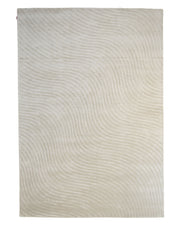 The Off White Handmade Rug - HTV 14 by RAMSHA HOME features a beige rectangular design with subtle, wavy, tone-on-tone lines that create a gentle, flowing pattern—making this modern textured rug a stylish yet neutral choice for contemporary living spaces.