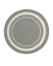 The RAMSHA HOME Grey & White Color Round Handmade Rug - HTWV-121 is an elegant handtufted wool rug featuring three concentric rings in white and light gray near the edge, set against a white background. Expertly crafted, this round grey and white rug offers both style and comfort to any space.