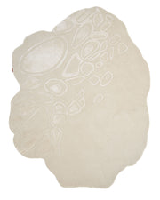 The Modern Sculptural Shape Rug Neutral Beige 200 cm – HTWV 207 by RAMSHA HOME features an irregularly shaped design in beige, with raised and recessed abstract patterns that evoke the look of pebbles or stones, creating a textured, organic aesthetic.