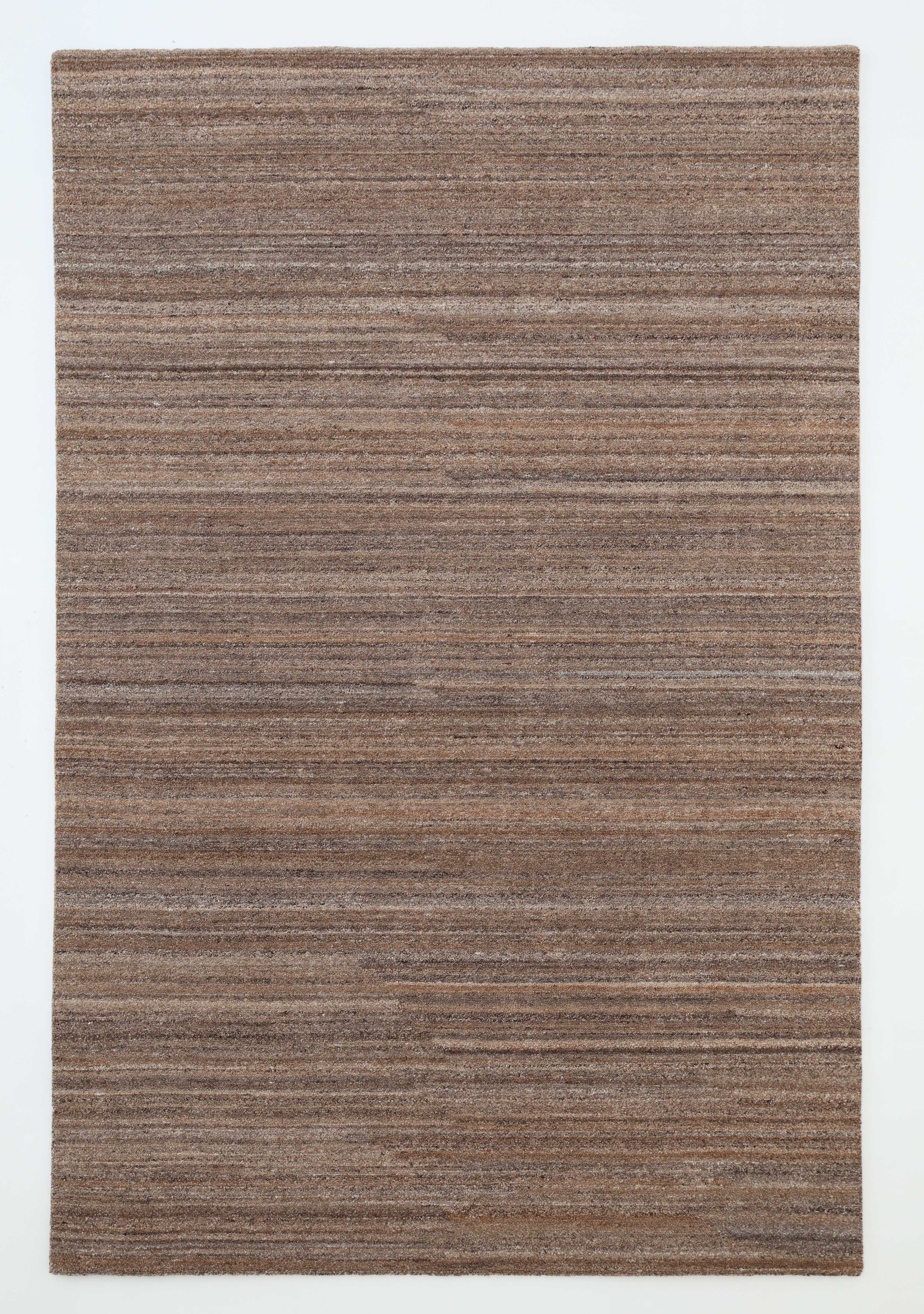 The RAMSHA HOME Handmade Earth Strata Wool Rug HTP 29 is a rectangular, minimalist area rug handwoven from natural fibers, featuring brown and taupe textured stripes, shown on a white background.