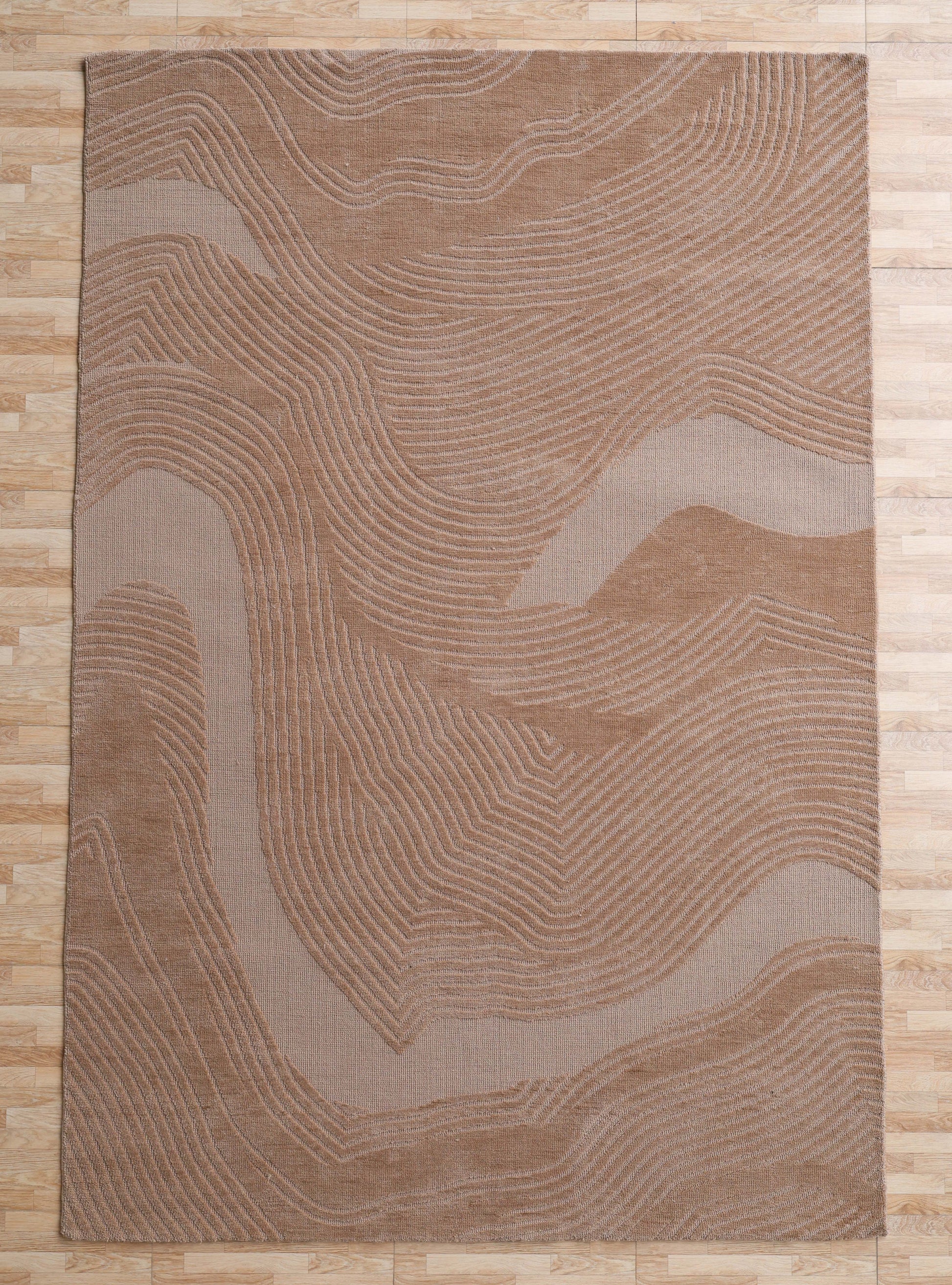 The RAMSHA HOME Terrain Design 200x300 CM Rectangle Shaped Rug CMN 112 features beige and tan abstract, wavy topographic line patterns and is pictured on a light wood floor.