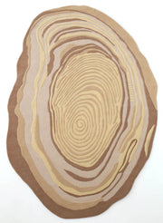The RAMSHA HOME Terra Eclipse Oval Handmade Rug HTWV-155 features an abstract, irregular oval shape with concentric, flowing lines in beige, tan, and brown tones on a white background.