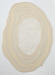 The RAMSHA HOME Ivory Topographic Shaped Rug 200x300 cm (HTWV-192) features modern, irregular shaping with wavy concentric lines like tree rings or topography, set against an ivory background.
