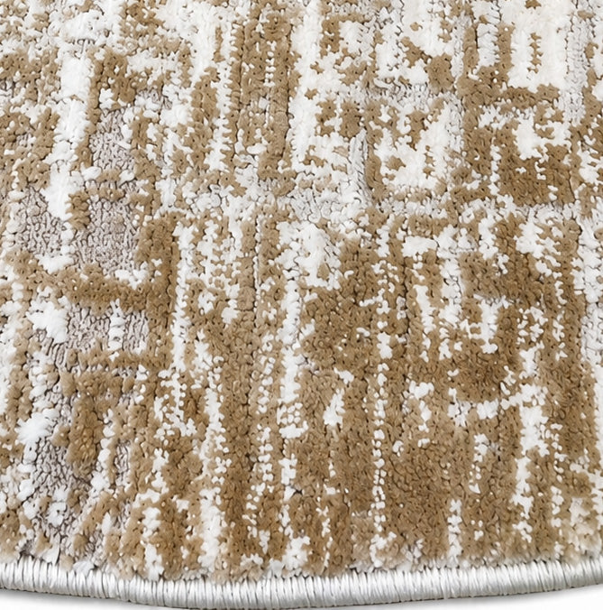 Close-up of the RAMSHA HOME Machine Made Turkish Area Rug - MR483 FLORENCE, showcasing its textured neutral surface with an abstract mix of beige, brown, and white tones. This modern distressed rug features a rounded edge and a tightly woven border.