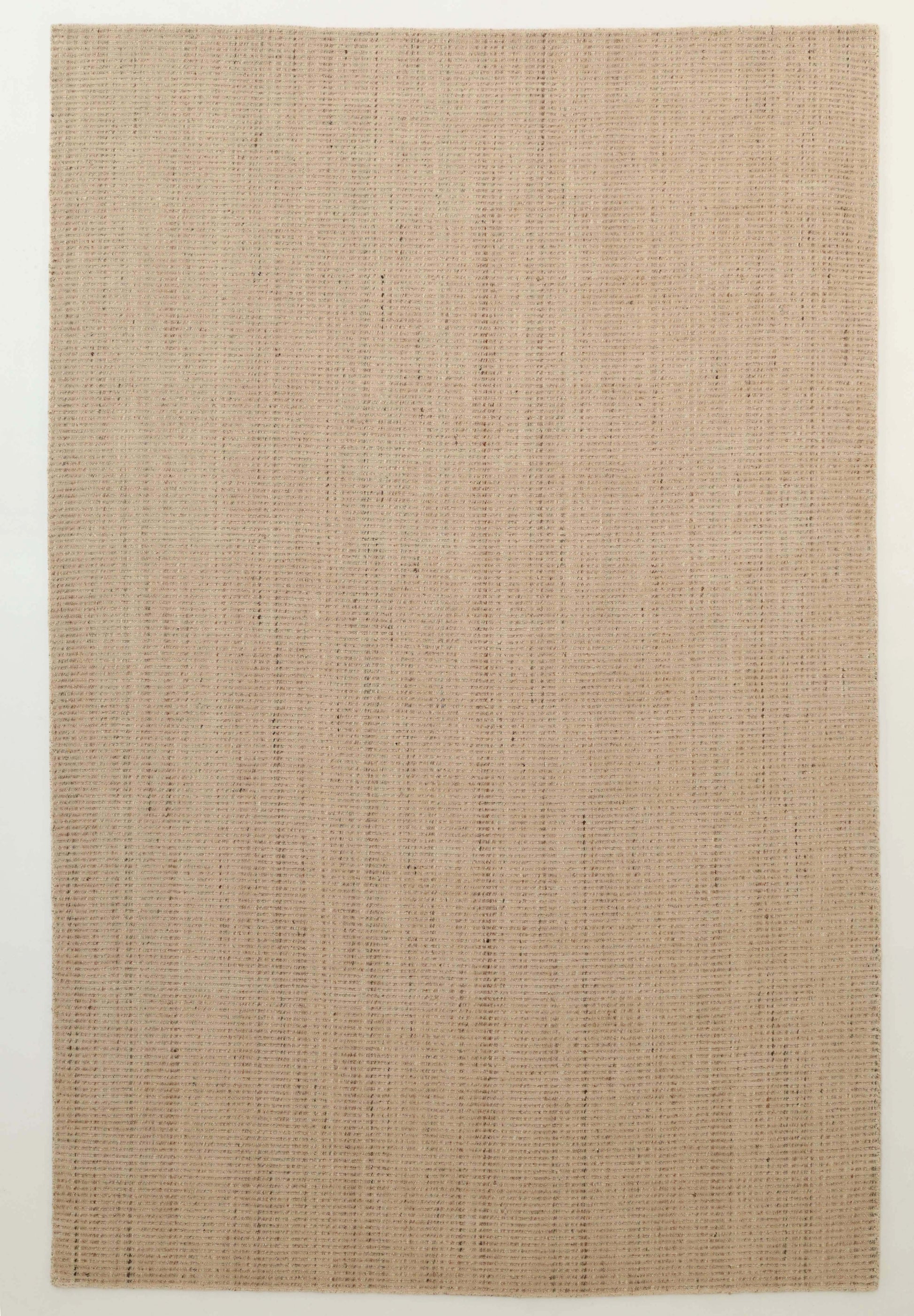 The Handmade Natural Wool Rug – Textured Beige Area Rug (HLR-002) by RAMSHA HOME features a minimalist rectangular design in beige, handwoven with natural fibers, and is shown on a plain light-colored floor.