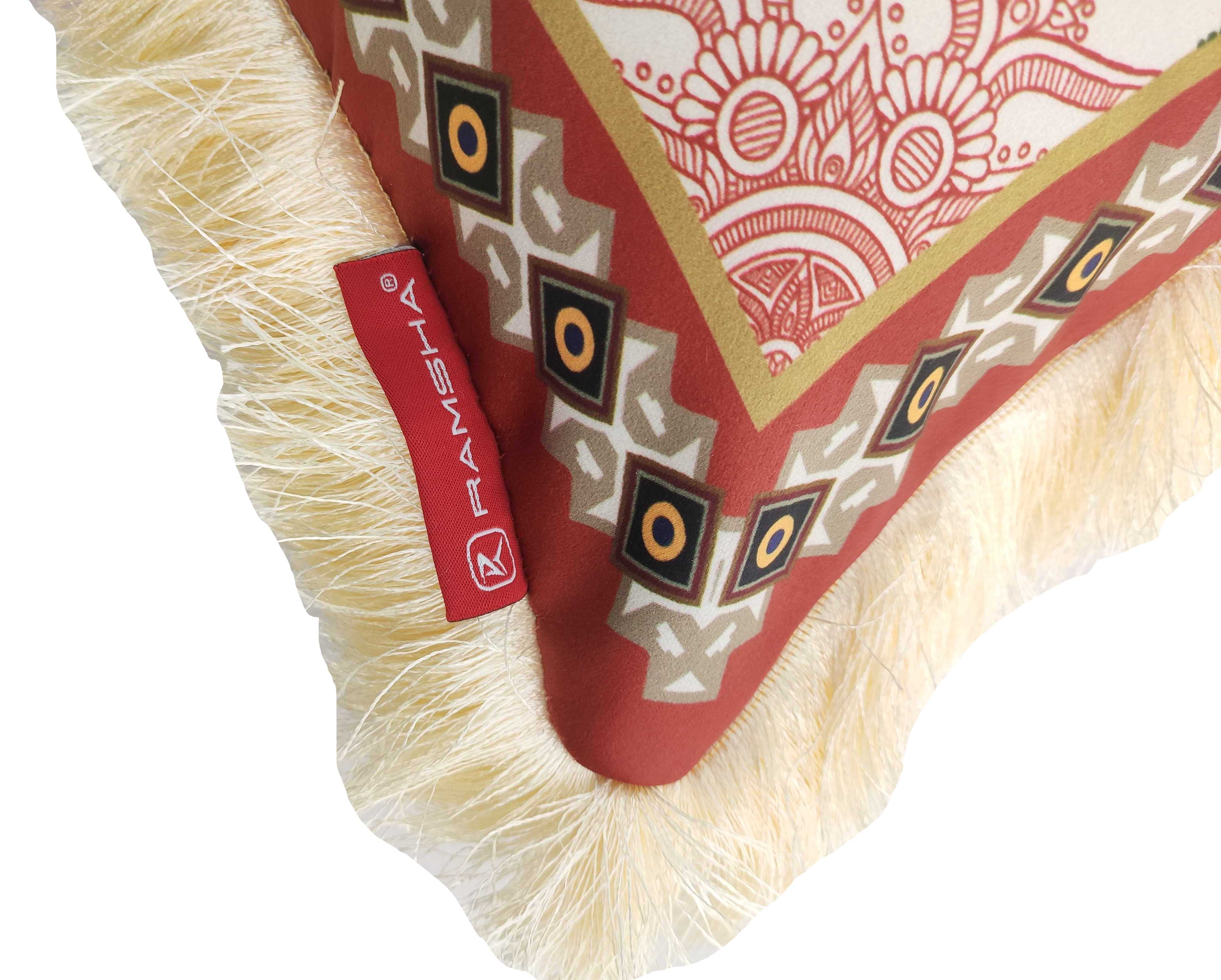 A close-up of the RAMSHA HOME Multi Decor Printed Cushion With Filler CS-061, featuring a red and beige geometric and floral pattern, beige fringe trim, and a red fabric tag.