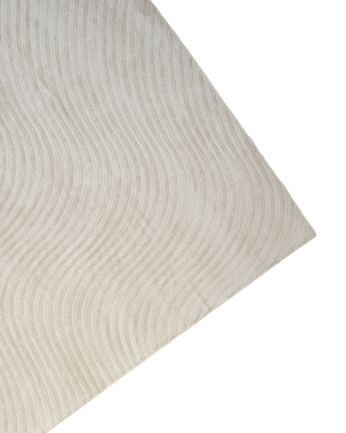 An Off White Handmade Rug - HTV 14 by RAMSHA HOME, featuring a subtle wavy line pattern, is displayed at an angle against a white background.