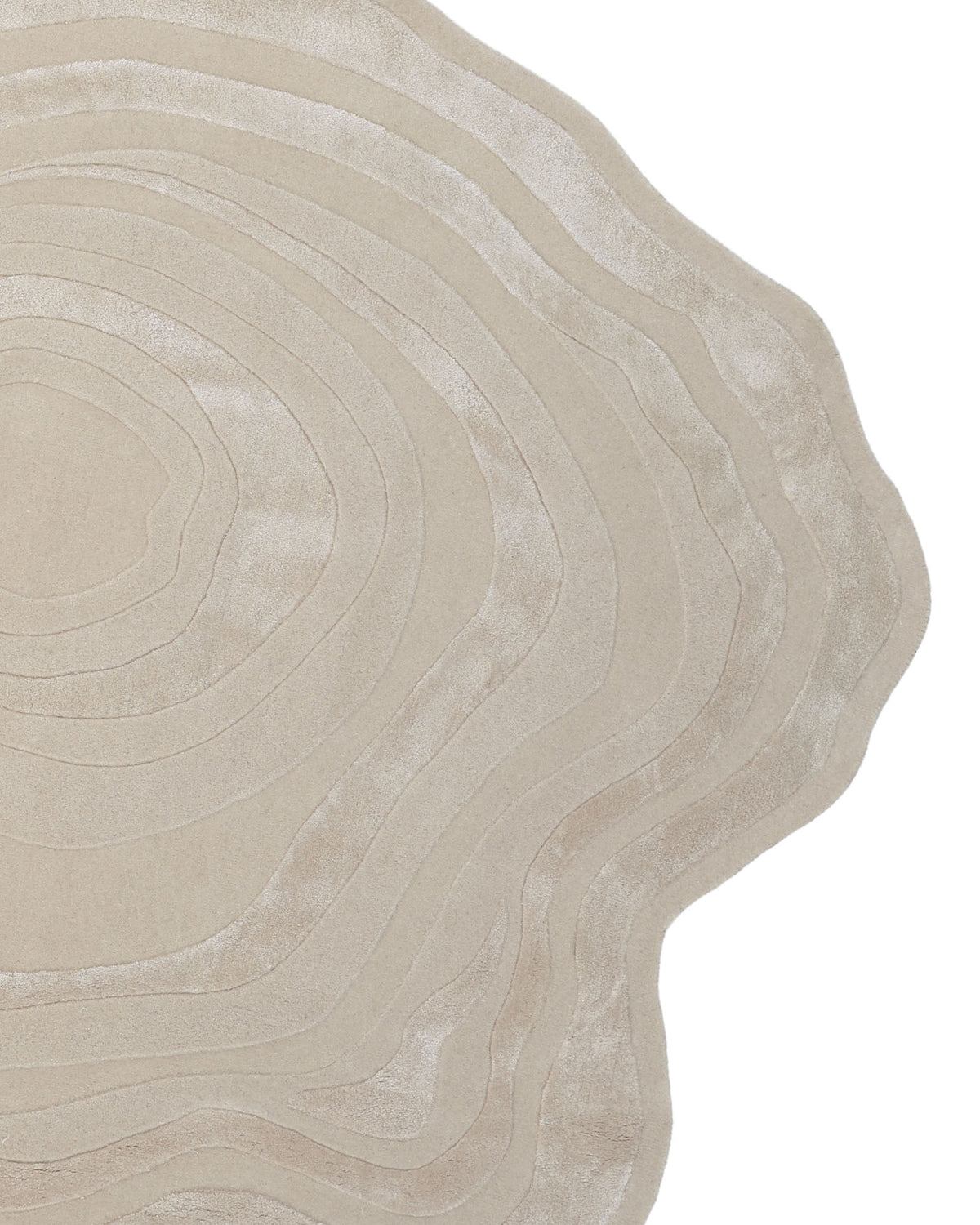 Introducing the Handmade Beige Organic Shape Rug with Wave Pattern 200x300 cm – HTWV 210 by RAMSHA HOME. This uniquely shaped, beige rug features concentric, wavy lines reminiscent of tree rings, lending a textured and layered appearance. Its modern, neutral design beautifully complements any white background or contemporary space.