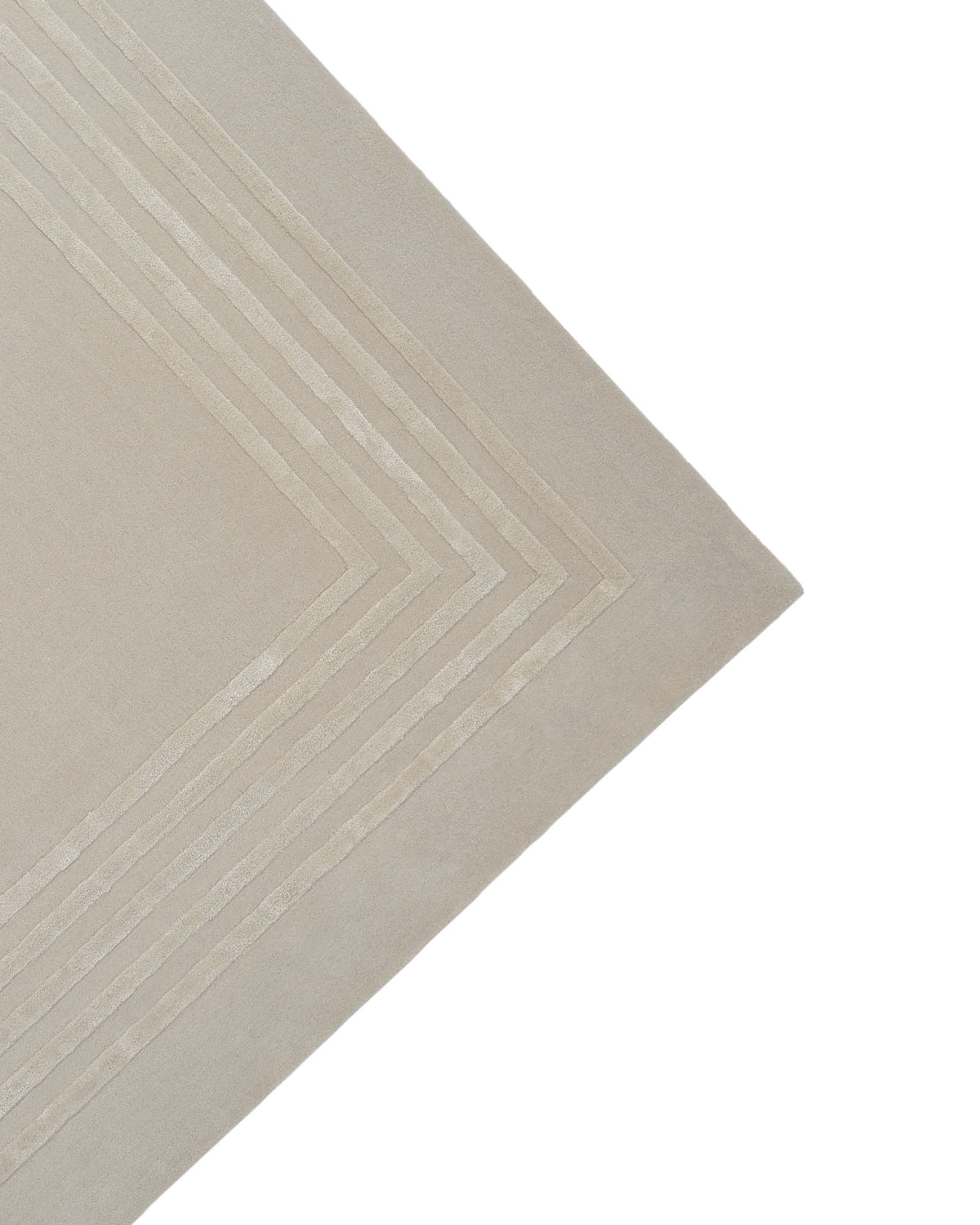 Corner of the RAMSHA HOME Hand-Tufted Carpet For Home And Office HTWV-70 in beige, featuring a contemporary geometric pattern of concentric, raised lines forming right angles near the edge, set against a white background—a sophisticated area rug ideal for minimalist interiors.