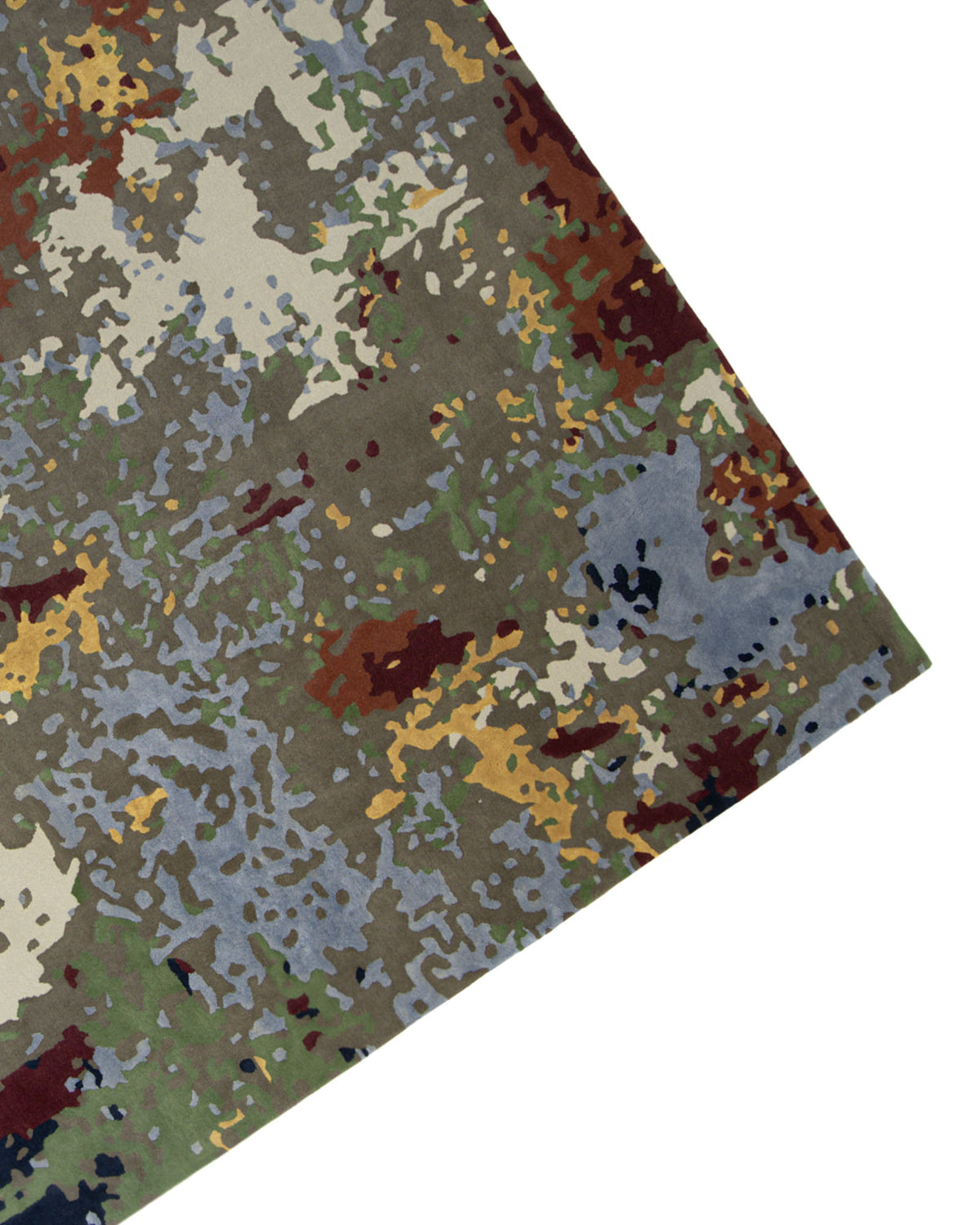 A close-up view of the Modern Artistic Handmade Rug 240x300 cm- ZUA-21 by RAMSHA HOME, showcasing its digital camouflage-inspired pattern in shades of green, brown, tan, blue, and gray. The contemporary abstract multicolor rug is displayed at an angle against a white background.