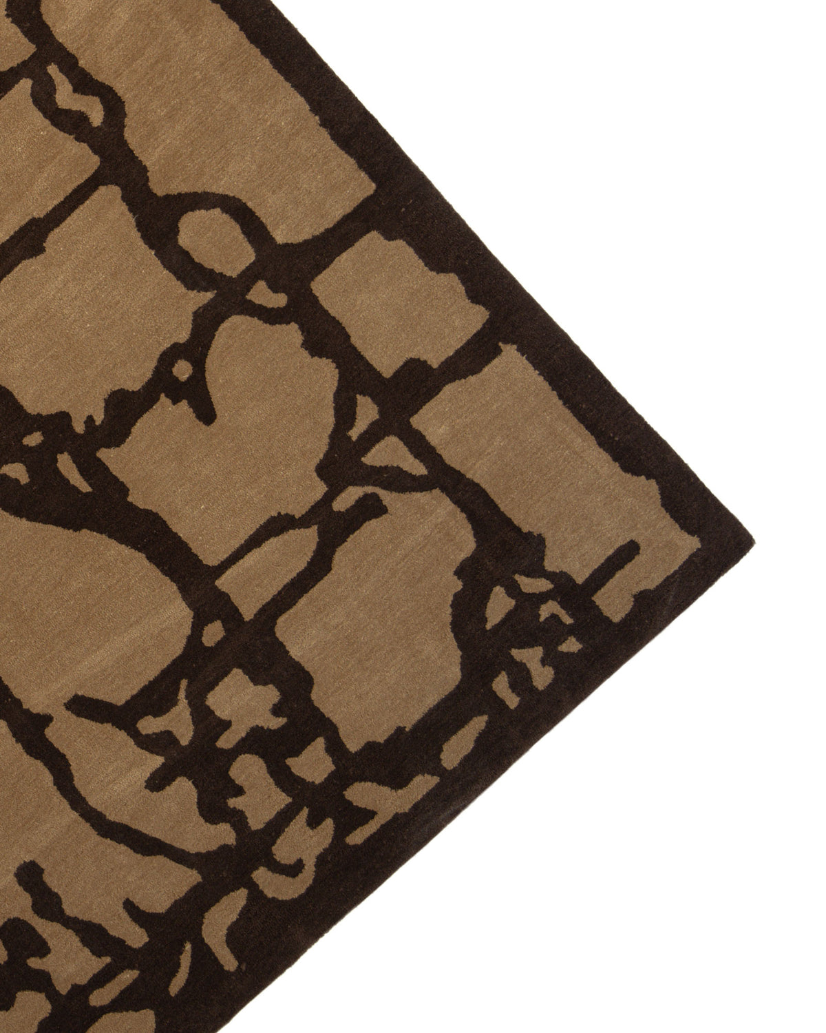 A close-up of the Multi Handmade Area Rug - HTP 21 (200x300cm) by RAMSHA HOME highlights its tan background accented with a bold, irregular dark brown abstract pattern, showcasing the unique artistry and craftsmanship of this hand-tufted piece.