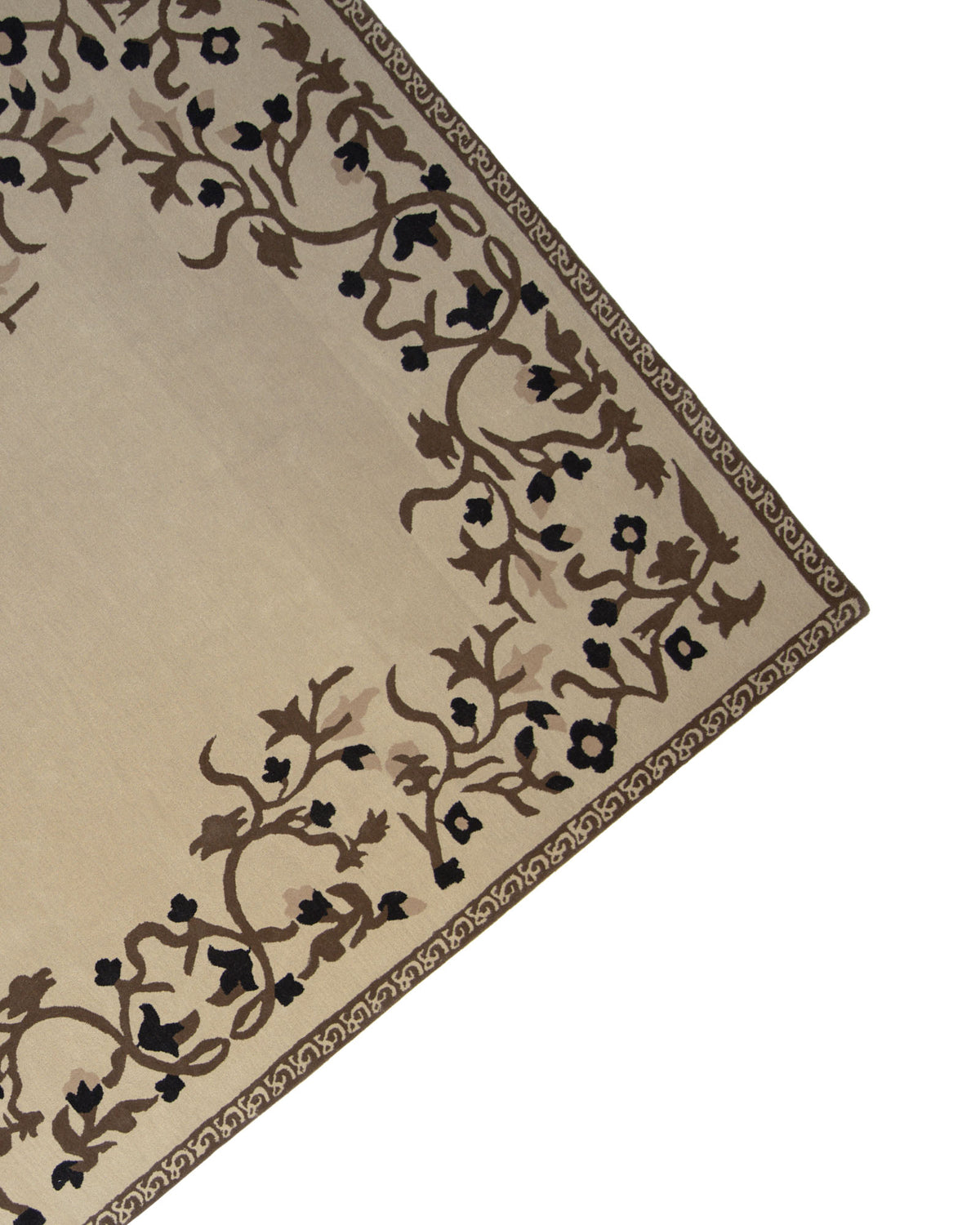 A corner of the RAMSHA HOME Multi Color Handmade Carpet 300X400 CM HTW-05 is shown, featuring a beige hand-tufted design with a brown and black floral border pattern and a decorative outer edge. The central area of this neutral wool rug remains plain, highlighting the intricate design concentrated along the borders.