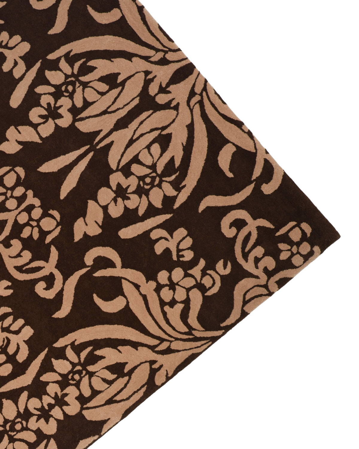 The RAMSHA HOME “Home Decor Dark Shade Handmade Carpet – HTW-31” is a hand-tufted wool area rug in a rich brown tone, showcasing an ornate beige floral and vine pattern accented with subtle damask motifs, pictured from one corner against a white background.