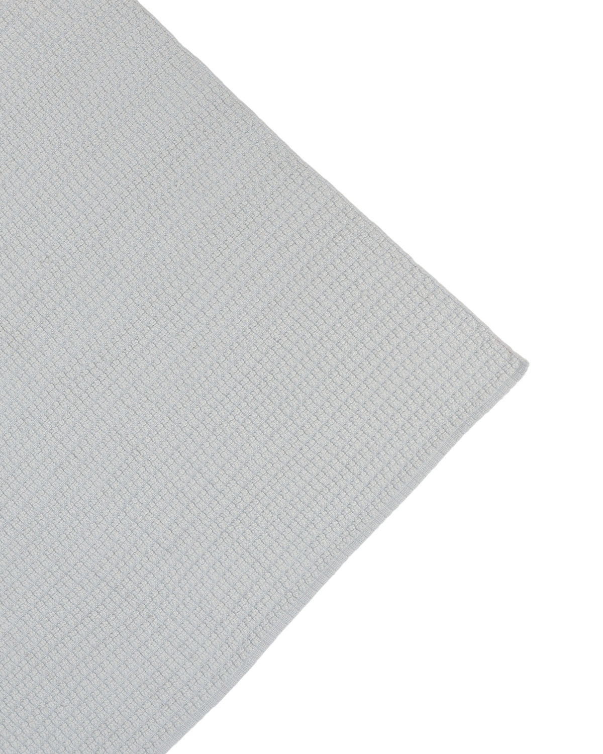 A close-up of the Handmade Cream Natural Color Hand Woven Area Rug WR-039 by RAMSHA HOME showcases its light cream hue, artisanal craftsmanship from natural fibers, and subtle grid pattern—presented diagonally against a white background as the perfect home décor accent.