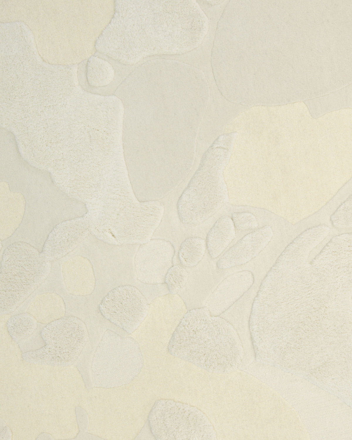 Featuring a textured cream and off-white surface with irregular, abstract shapes and raised areas that evoke a subtle, organic pattern reminiscent of soft camouflage, the Creative Multi Color Wool & Cotton Handmade Rug - HTW 69 (200x300cm) by RAMSHA HOME is an ideal inspiration for a neutral abstract rug crafted in hand-tufted wool.