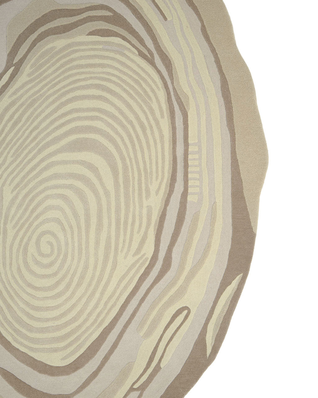 Close-up of the RAMSHA HOME Terra Eclipse Oval Handmade Rug Accent Rug HTW-155, featuring an abstract, circular pattern reminiscent of tree rings or a fingerprint in shades of beige, tan, and brown on a white background. Only a portion of this handmade rug’s design is visible.