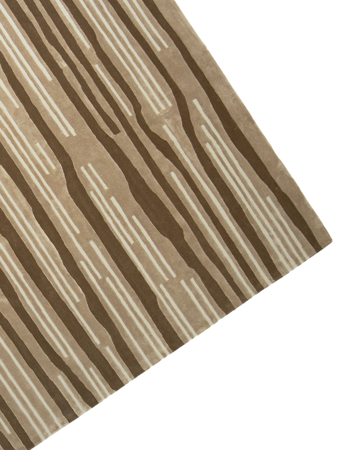 A corner of the Amazing Multi Color Bedroom Floor Rug - ZUA 13 (250x350cm) by RAMSHA HOME is shown, featuring a modern beige and brown striped design with a wood grain pattern. The handtufted rug displays alternating thick and thin lines reminiscent of tree rings on a white background.