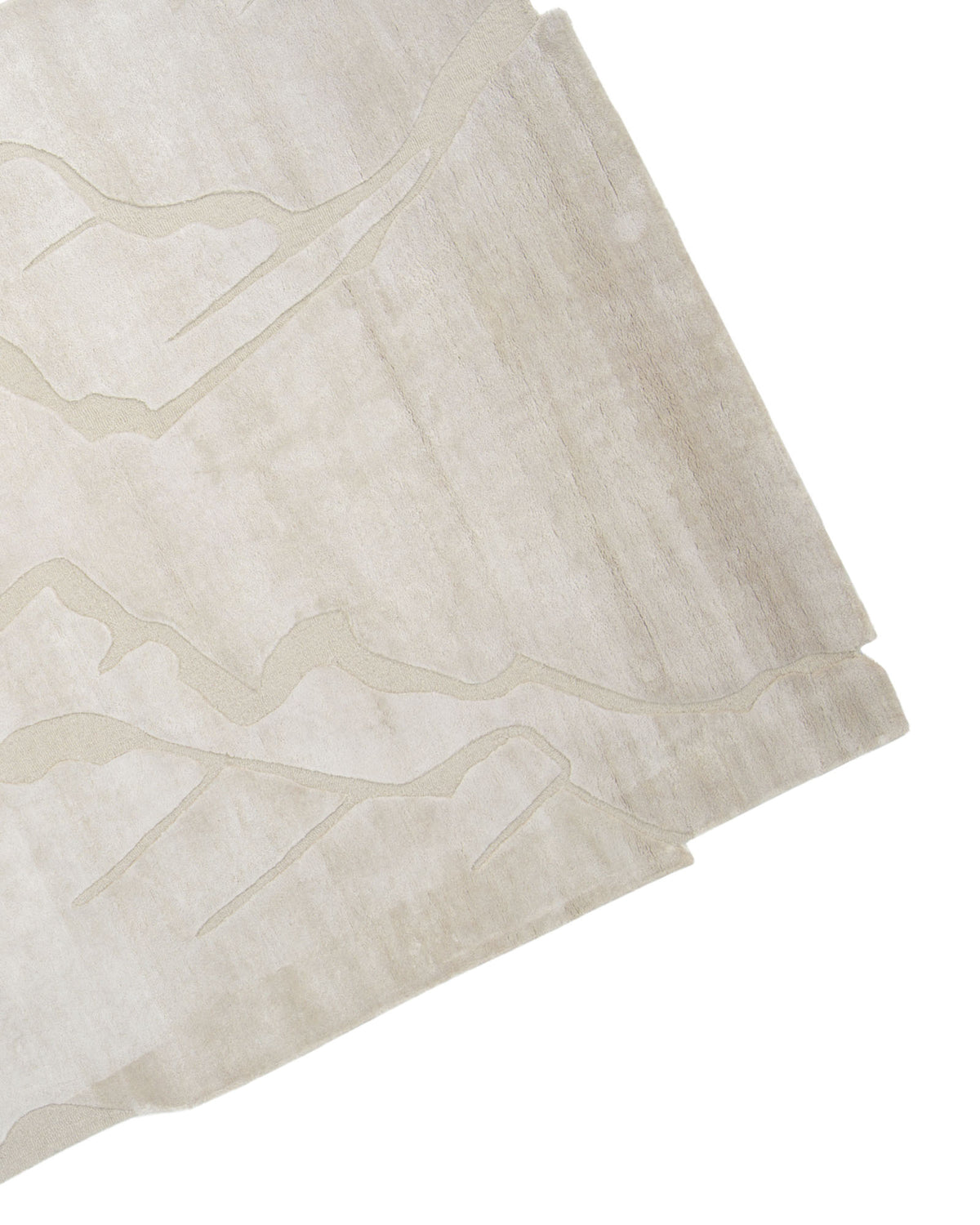 A close-up of the RAMSHA HOME Modern Viscose & Wool Handmade Carpet 200x300 – HTWV-172, featuring a beige viscose blend with subtle raised abstract lines and geometric cut edges, photographed on a white background.