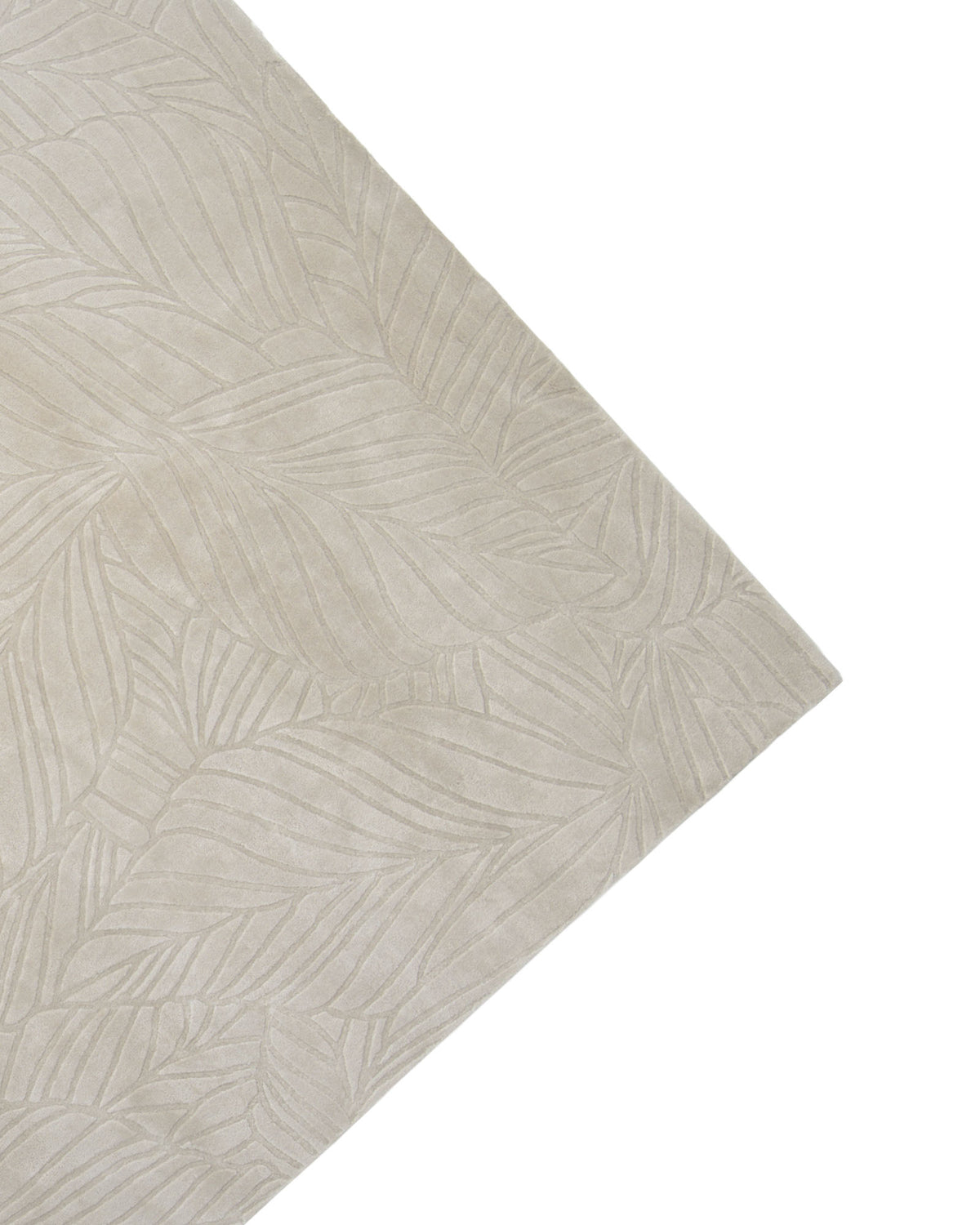 A top angled view displays one corner of the RAMSHA HOME Rectangle Shape Beige Color Handmade Area Rug - HTV 25 (200X300 cm), featuring a neutral beige tone and subtle abstract leaf pattern, set against a white background.