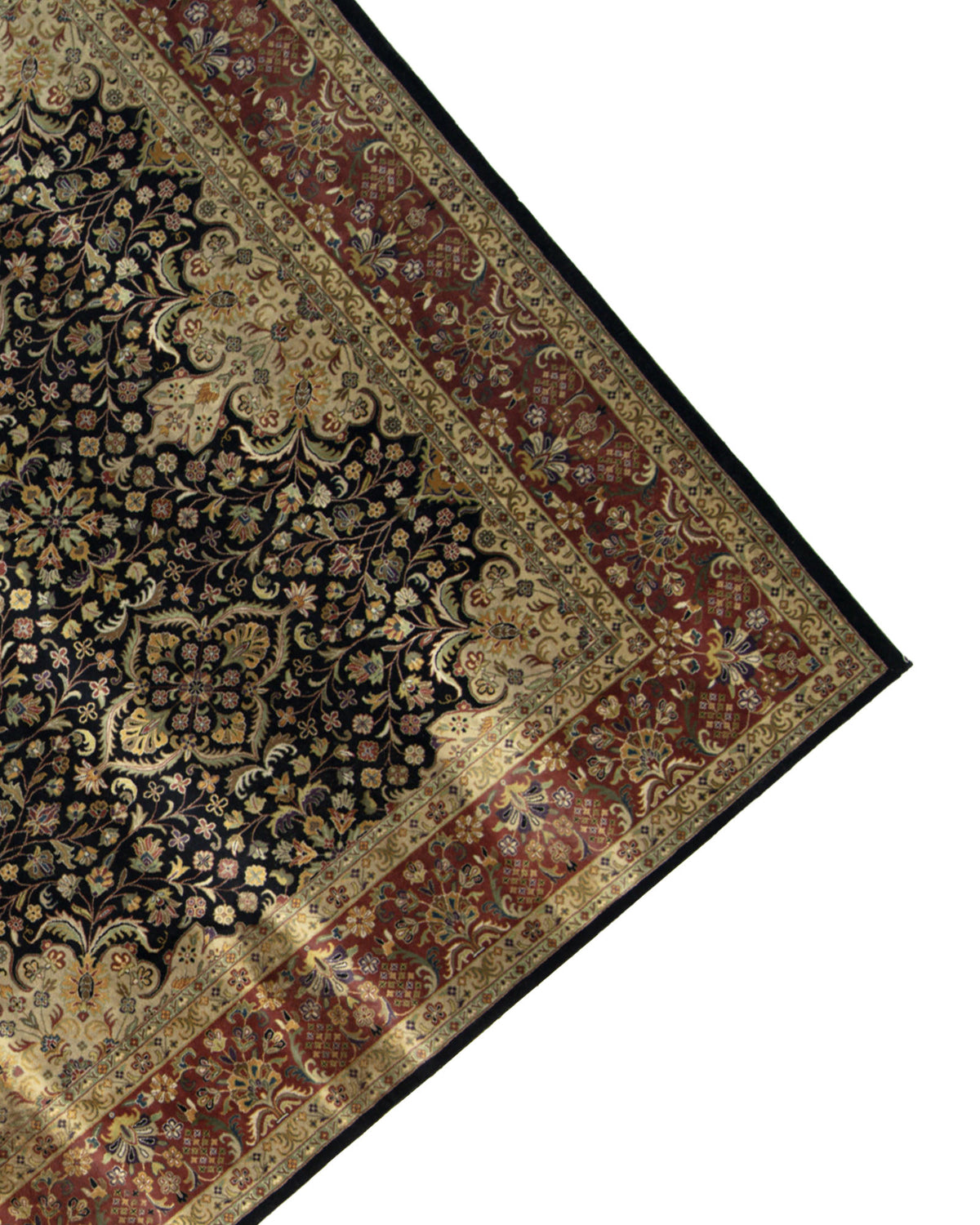 The image shows the corner of the RAMSHA HOME Persian Design Area Rug - HKW-06, featuring a dark floral pattern and a wide red and gold border against a white background. Only part of the intricate design of this hand-knotted wool area rug is visible.