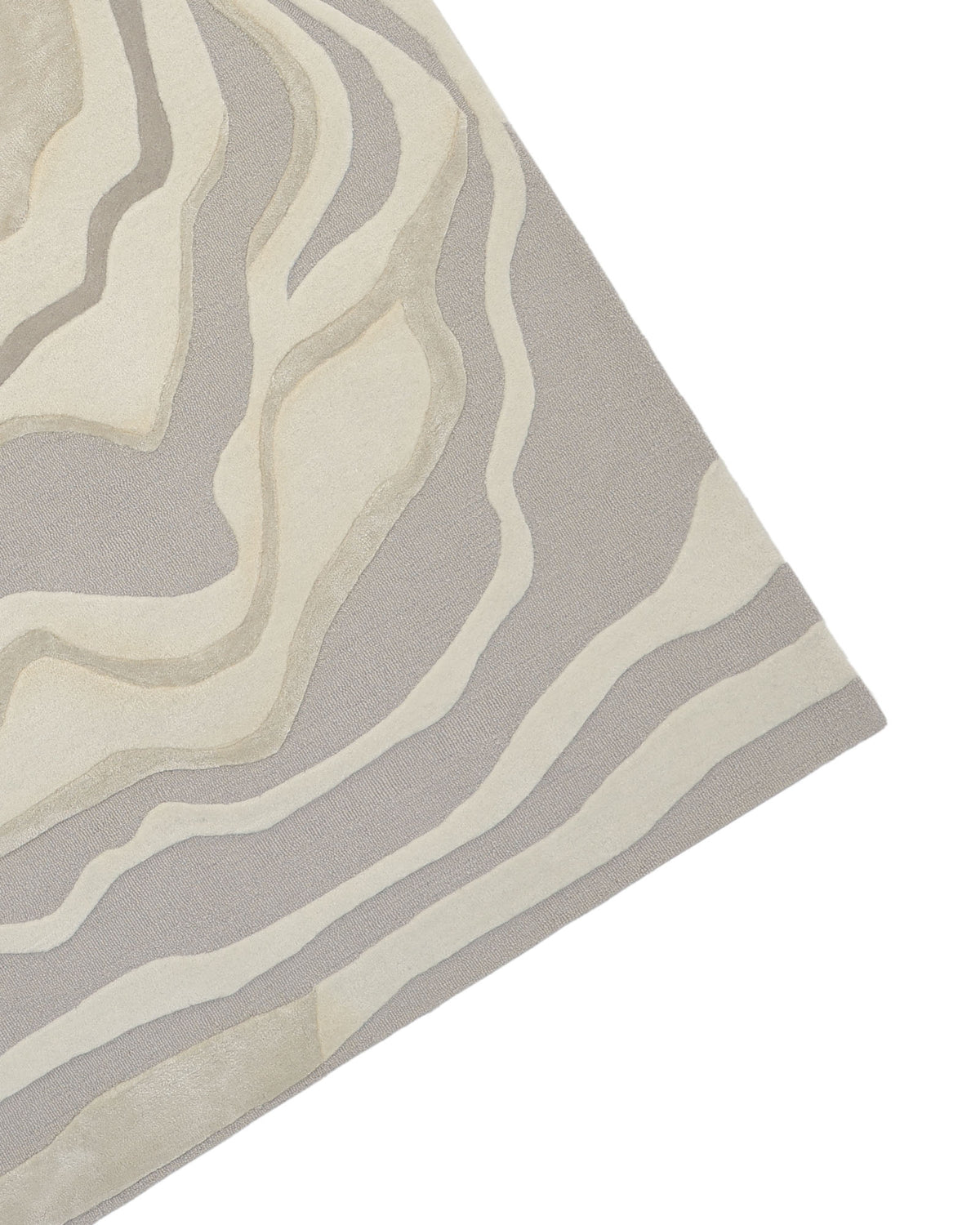 The visible corner of the RAMSHA HOME Handcrafted Living Room Area Rug – HTWV-127 features abstract, wavy, beige and light gray layered patterns reminiscent of topographic map lines, showcased against a white background.
