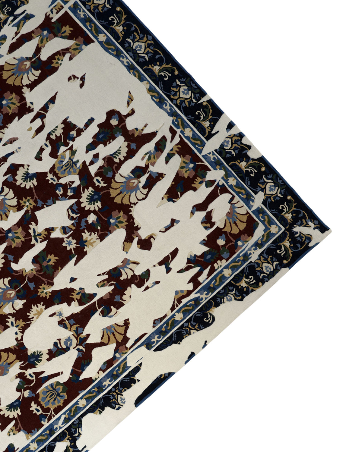 A patterned corner of the RAMSHA HOME Multi Color Handmade Area Rug - HTW 111 (300x400 cm) is partially overlaid with irregular white shapes, obscuring elements of its intricate floral and geometric designs.
