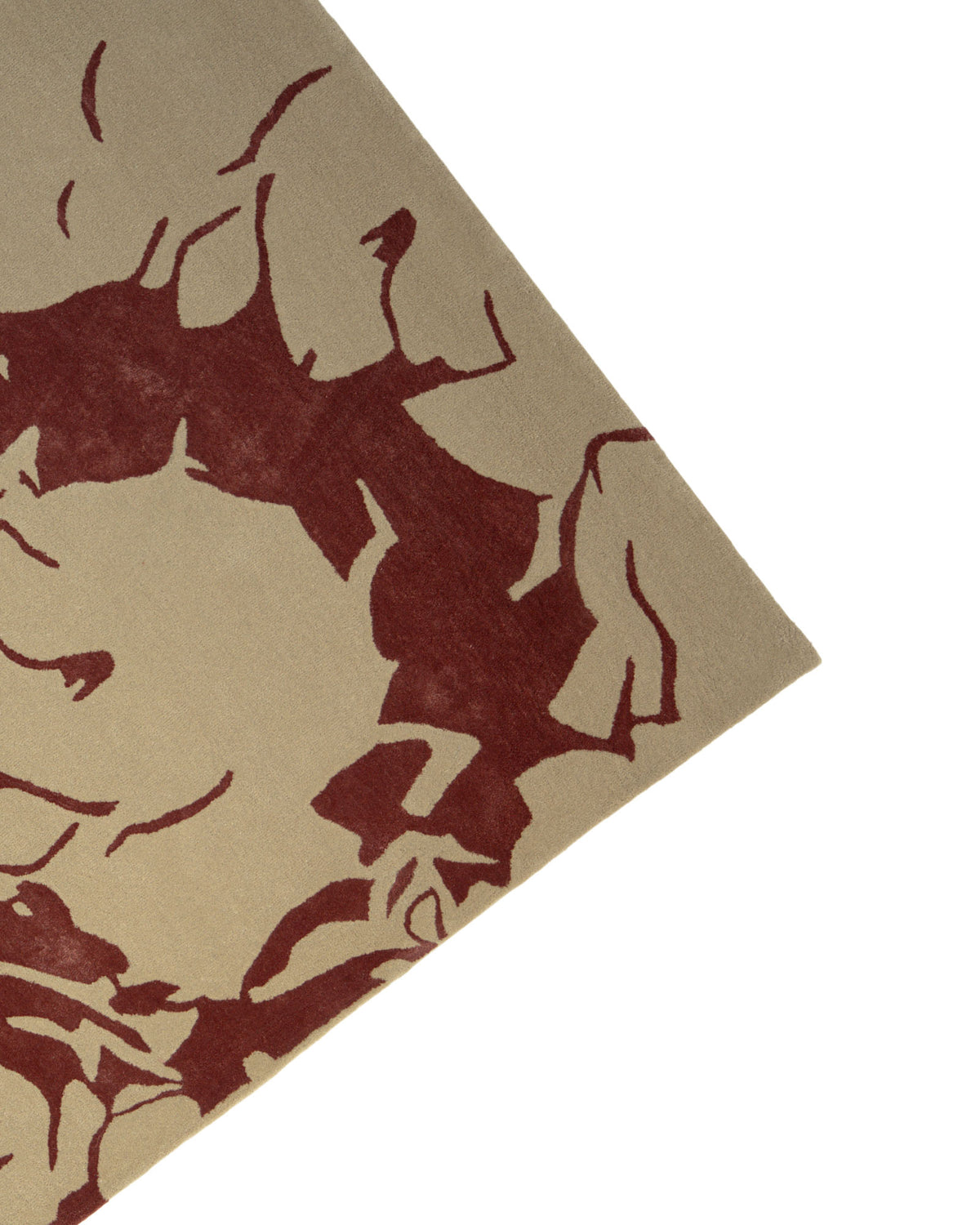 A close-up of the Abstract Burgundy Floral Rug – Modern Artistic Design 153x245 cm- CNZT 16 by RAMSHA HOME highlights its contemporary beige background adorned with an artistic abstract dark red pattern, resembling a modern burgundy floral motif, with one corner featured against a white backdrop.