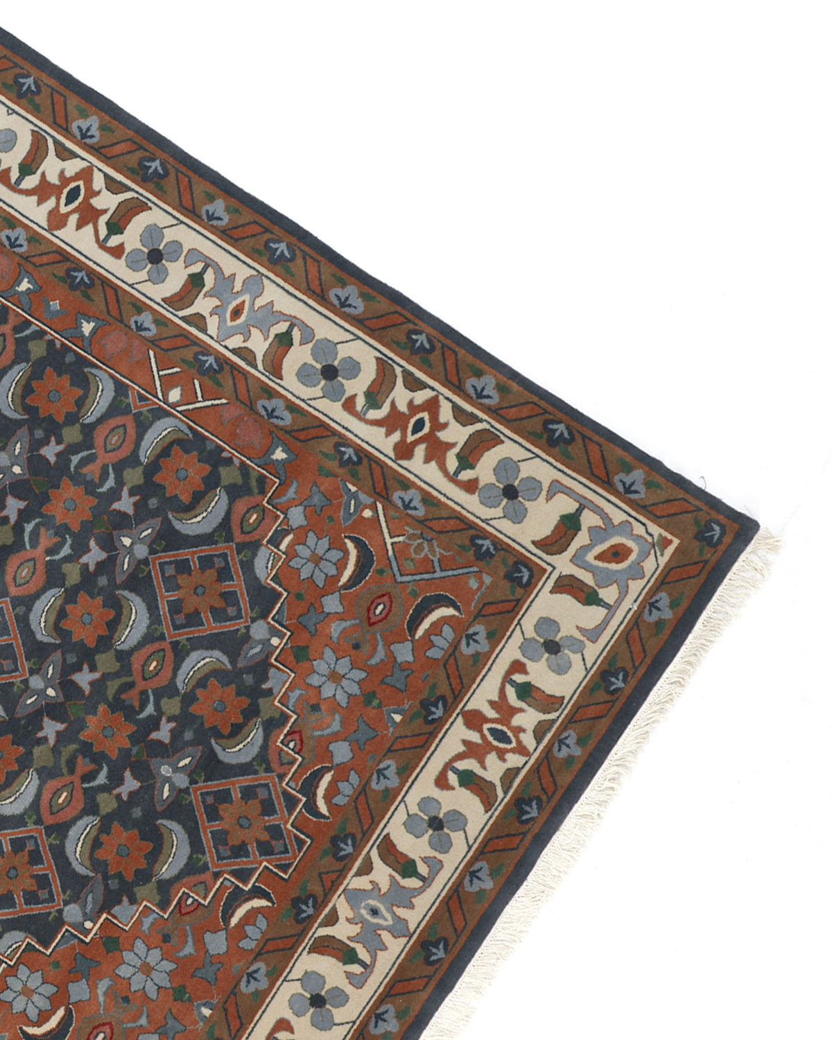 The image shows the corner of the RAMSHA HOME Hand Knotted Traditional Persian-Inspired Floral Medallion Rug (240x375 cm, HKW-07), highlighting its intricate blue, red, and beige floral patterns, detailed border, and white fringe against a white background.