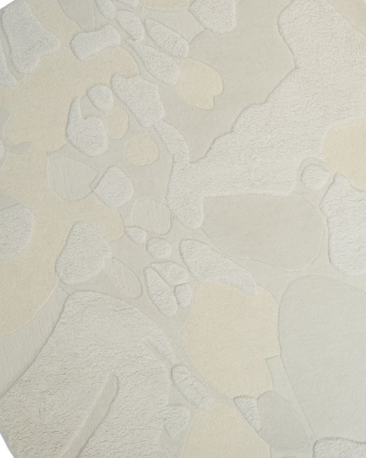 Experience the organic elegance of RAMSHA HOME’s Creative Multi Color Wool & Cotton Handmade Rug – HTW 69 (200x300cm), featuring a close-up of its hand-tufted texture with irregular, overlapping shapes in soothing beige and cream tones—perfectly capturing the natural charm and artisanal appeal of a neutral abstract or irregular shape rug.