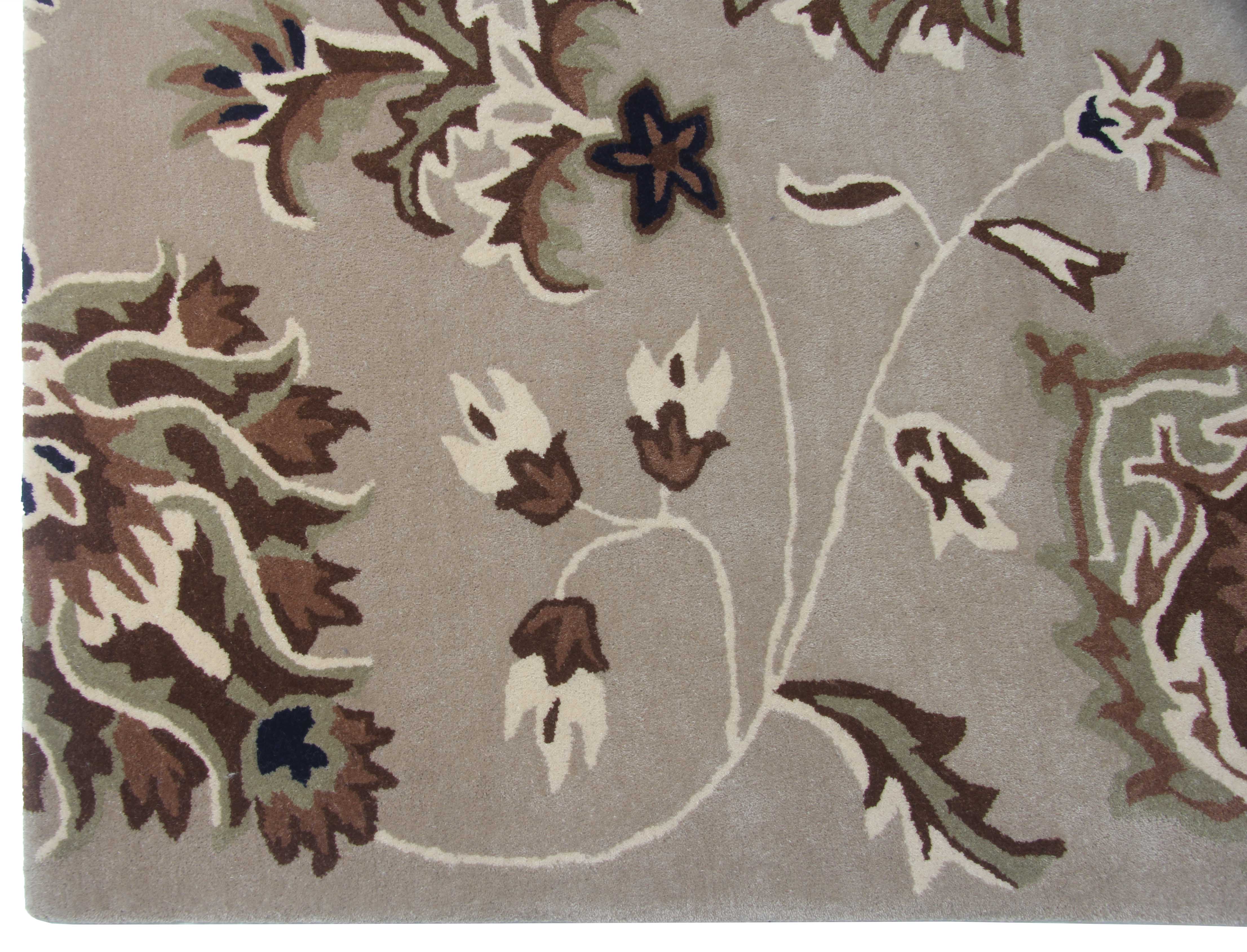 The RAMSHA HOME Exquisite Multi Color Handmade Rug - HTW 09 (200x300 cm) features a beige base with ornate abstract floral patterns in brown, cream, green, and dark blue on a light background.