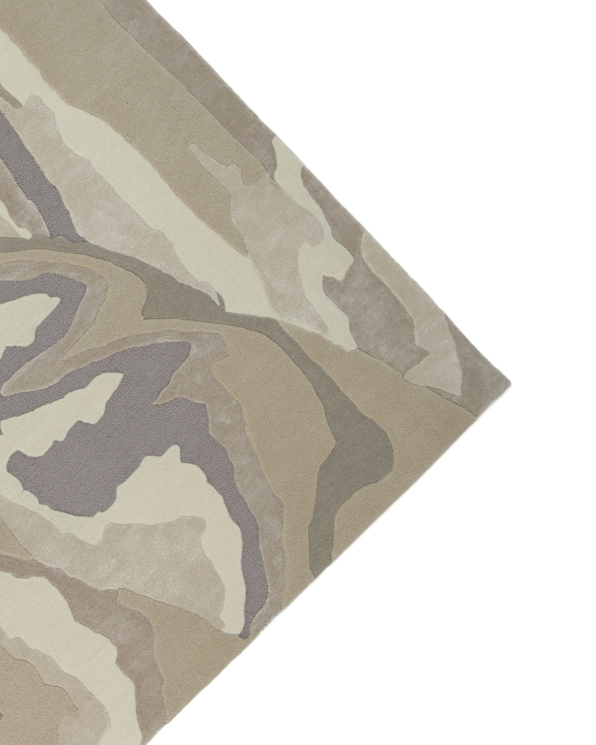 A close-up of the corner of the RAMSHA HOME Abstract Wool & Viscose Handmade Carpet 200x300 – HTWV-179 highlights its abstract, wavy pattern in beige, cream, gray, and taupe tones. Expertly hand-tufted from a blend of wool and viscose, this neutral rug offers a soft and stylish finish for any space.