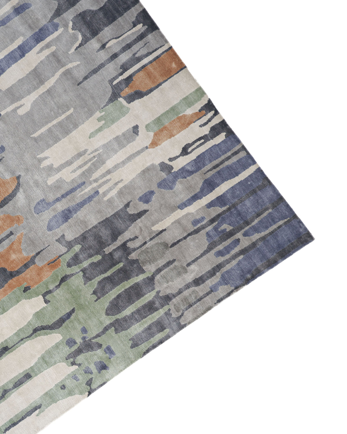 Decorative Area Carpet Tencil & Cotton Multi Color HKV-09 by RAMSHA HOME, featuring an abstract, watercolor-inspired pattern in blue, gray, green, and brown hues. This hand-knotted rug is shown from an angled top-down view against a white background and offers a truly unique and artful design for any modern space.