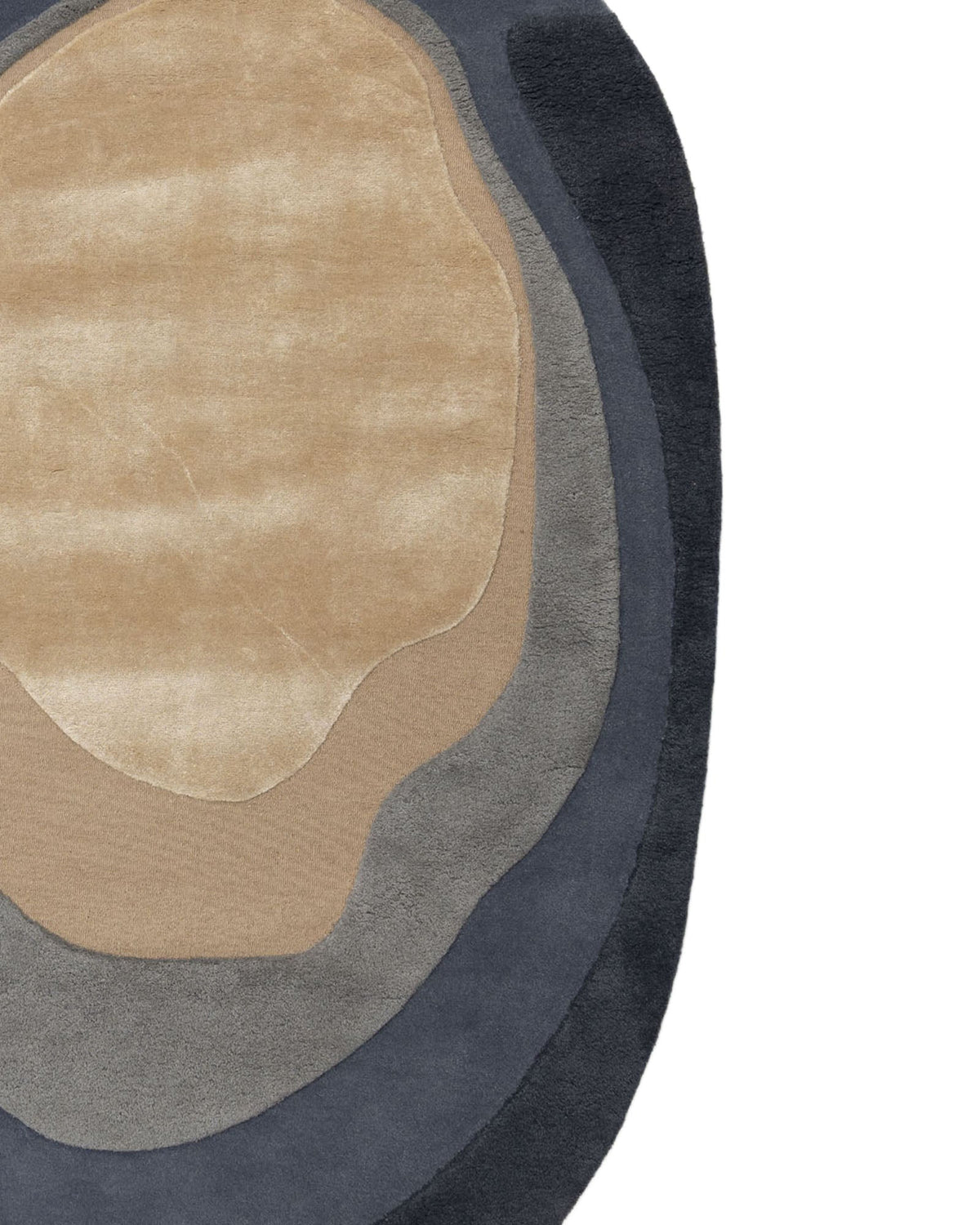 The Oval Shape Home Decor Multi Color Rug HTWV-90 by RAMSHA HOME features an abstract hand-tufted design with irregular, layered shapes in beige, light gray, dark gray, and black on a white background. Resembling topographic map lines or geological layers, this modern wool rug brings sophisticated texture and contemporary flair to any space.