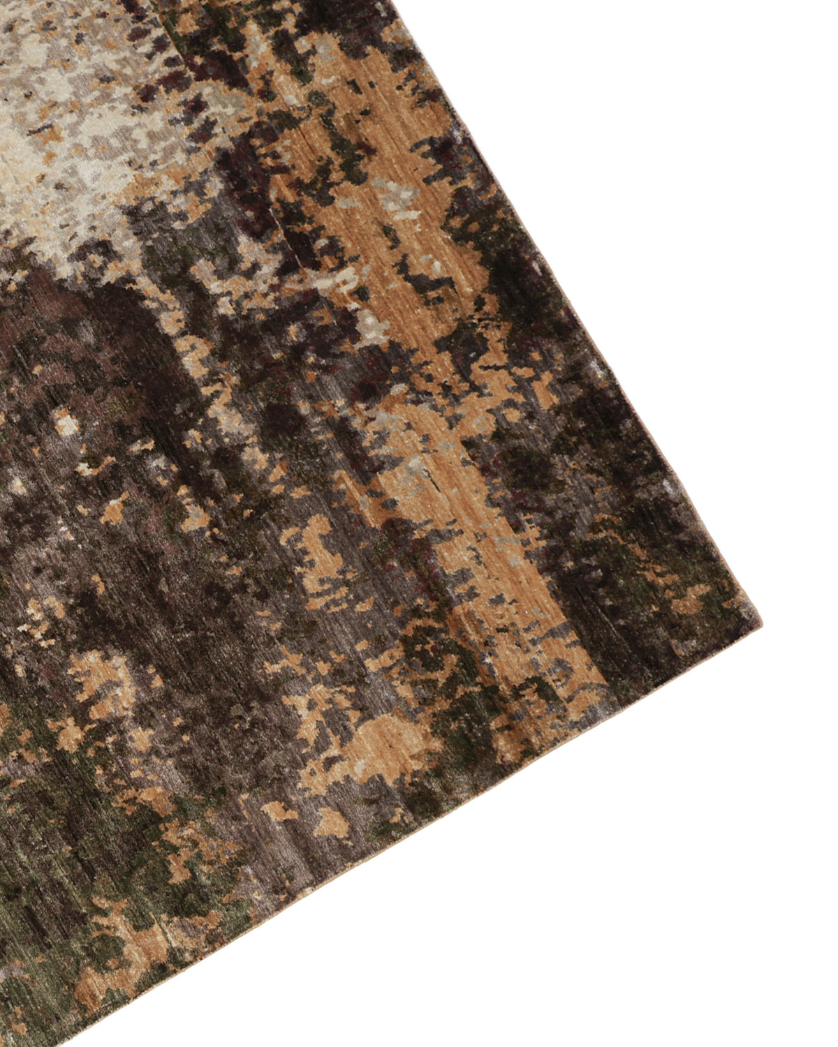 A corner of the RAMSHA HOME Hand Knotted Abstract Vintage-Inspired Bamboo Silk Rug KNTC 22-200x300 CM, featuring a mottled pattern in brown, tan, cream, and hints of green on a white background.