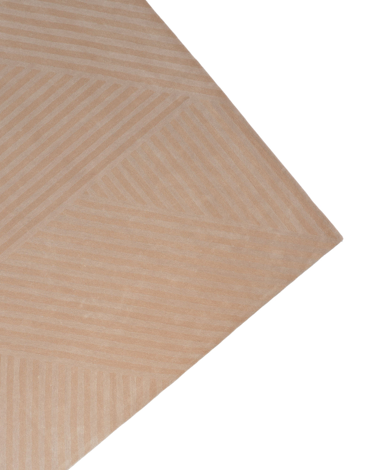 A close-up of the RAMSHA HOME Beige Hand Tufted Area Rug 250x350 cm (AL-05) showcases its geometric pattern of diagonal and horizontal lines, with the rug’s corner standing out elegantly against a crisp white background.