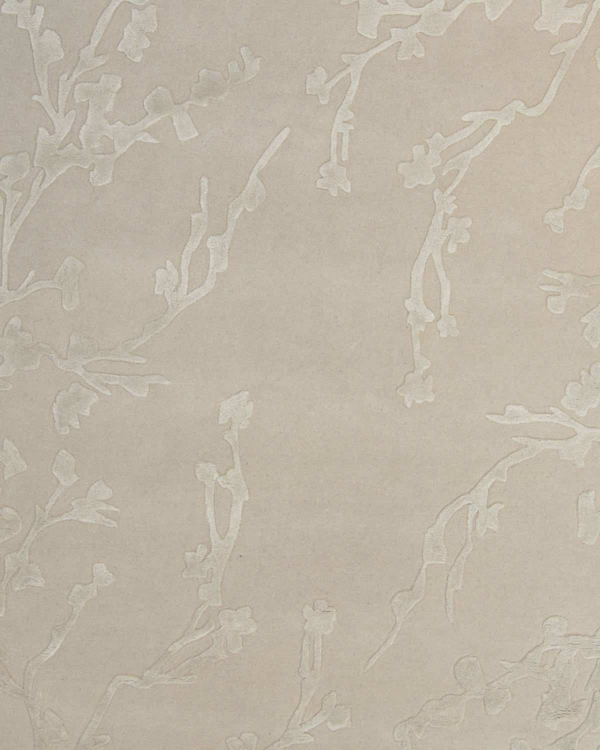 Featuring a beige background adorned with a subtle, raised floral pattern of blooming branches, the Decorative Handmade Area Rug HTWV-118 by RAMSHA HOME offers a soft and elegant textured design—making it the perfect floral textured rug to bring sophisticated style to any neutral bedroom.