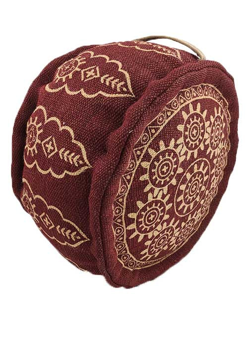 The RAMSHA HOME Red Color Jute Pouf With Handle PF-059 is a round bag with a handle, featuring intricate yellow floral and geometric patterns, reminiscent of a printed ottoman.