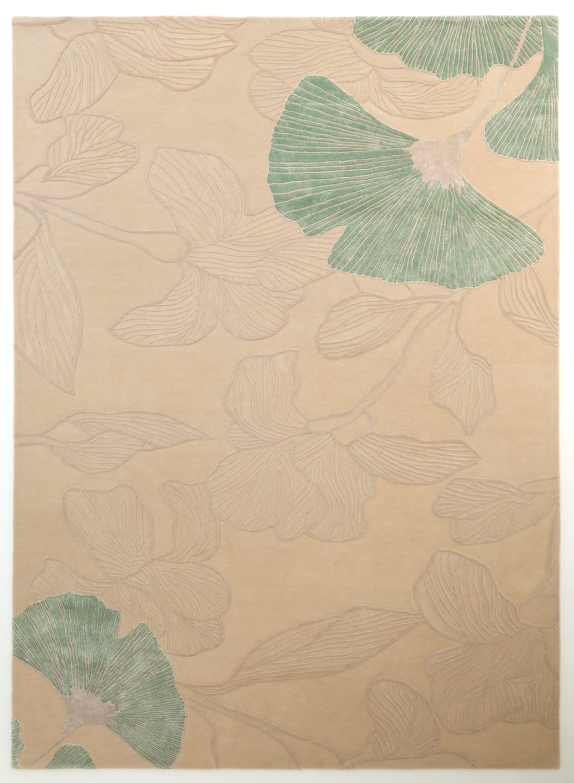 The RAMSHA HOME Floral Handmade Rectangle Rug HTWV-189 features a beige background with subtle botanical patterns and faint floral outlines, including two green leaves, for a delicately textured artisanal look.