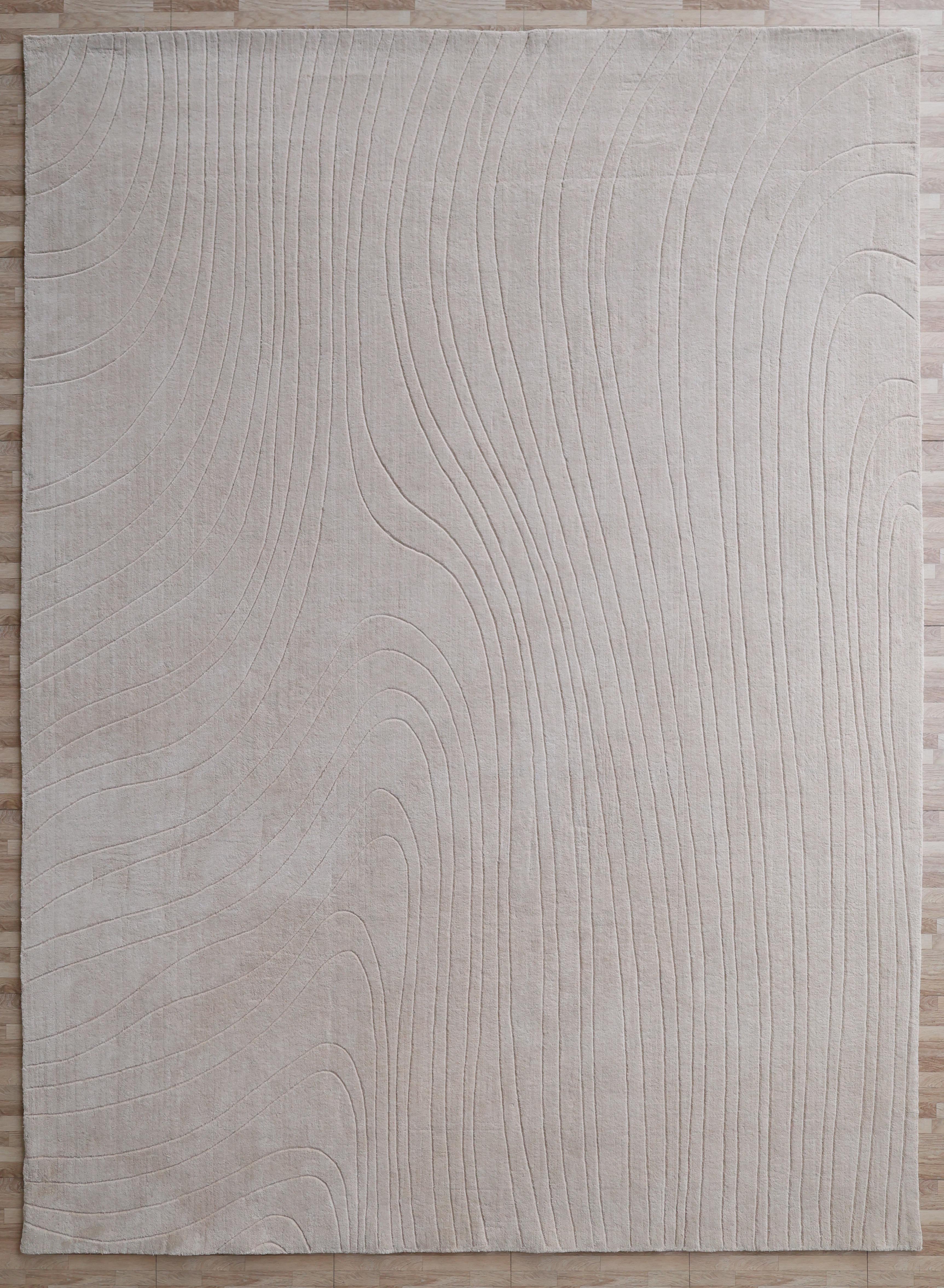 The RAMSHA HOME Modern Handmade Area Cream Color Rug (300x400 cm, LKH-046) features a rectangular shape with subtle wavy raised lines in an abstract pattern, shown on a light wood floor.