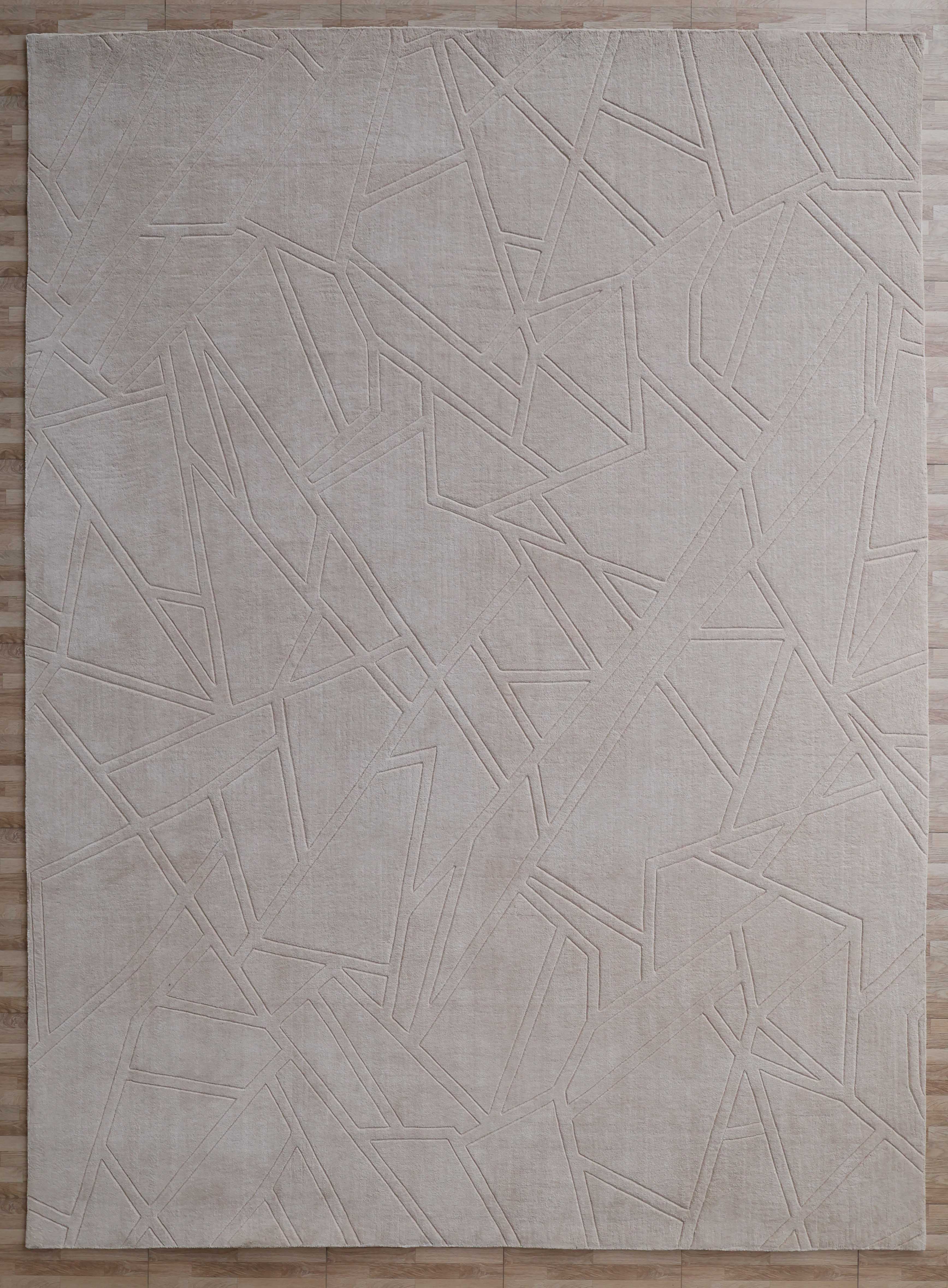 The Rectangle Home Decor Cream Color Handmade Area Rug (300x400 cm, LKH-045) by RAMSHA HOME features an abstract geometric pattern in cream on a light wooden floor, adding modern elegance and texture to your space.