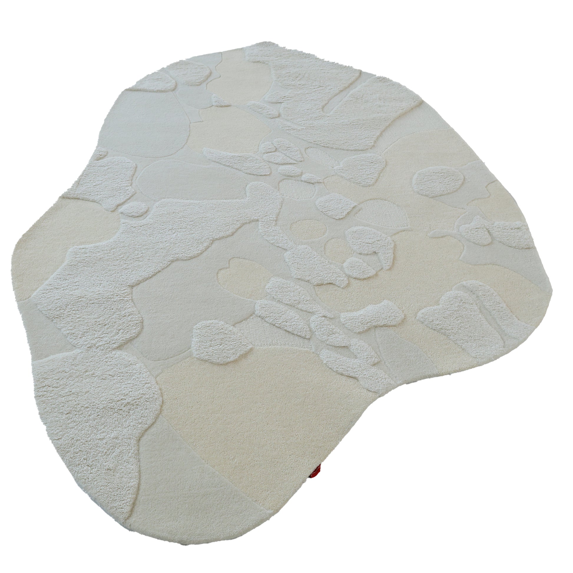 The RAMSHA HOME Creative Multi Color Wool & Cotton Handmade Rug - HTW 69 (200x300cm) features textured, raised abstract patterns and a soft, plush surface, crafted with hand-tufted wool and cotton in an irregular off-white design.