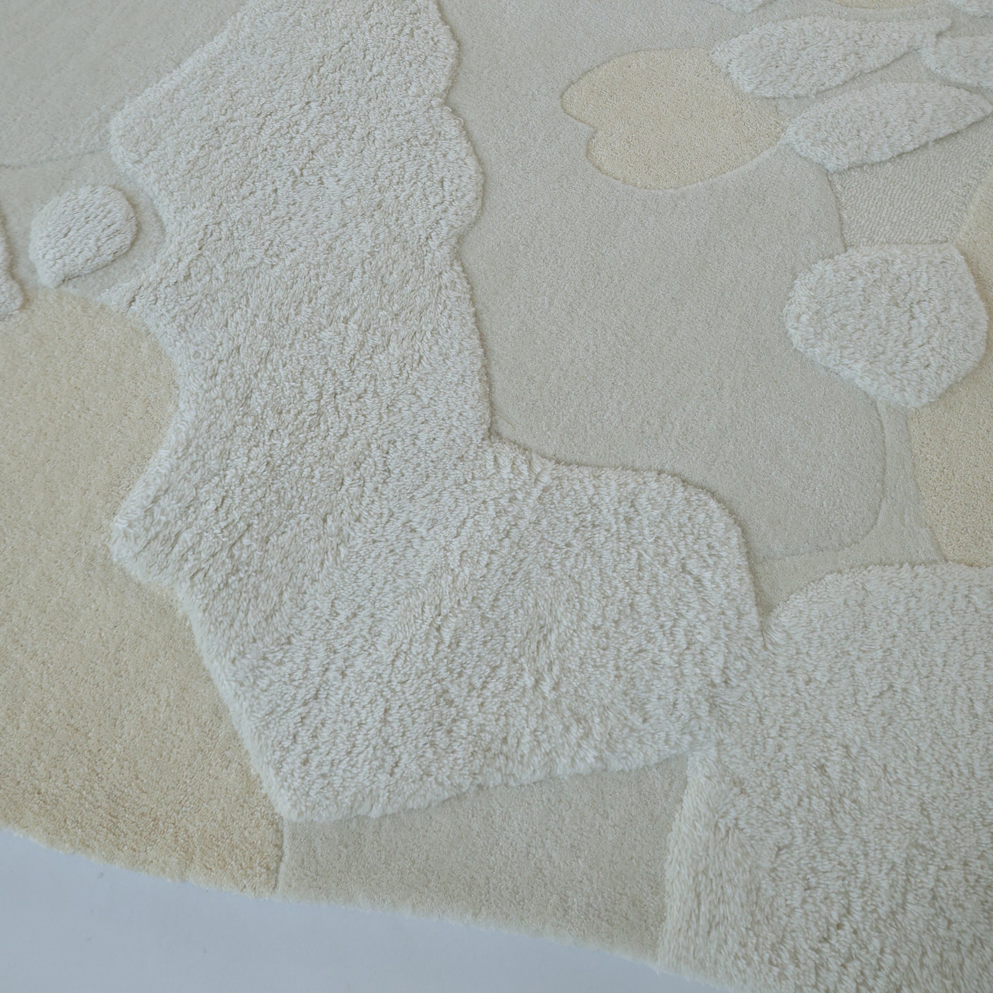 The Creative Multi Color Wool & Cotton Handmade Rug - HTW 69 (200x300cm) by RAMSHA HOME features a hand-tufted design with abstract, organic patterns and varied pile heights for a subtle 3D sculpted effect.