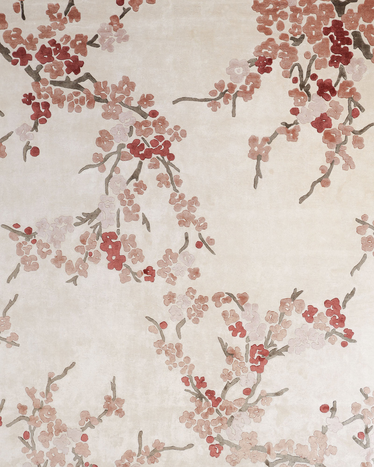 The RAMSHA HOME Floral Blossom Area Rug – Beige Pink & Terracotta (300x400 CM, HTV-30) features a cream-toned backdrop adorned with elegant, repeating branches of pink, red, and brown cherry blossoms.