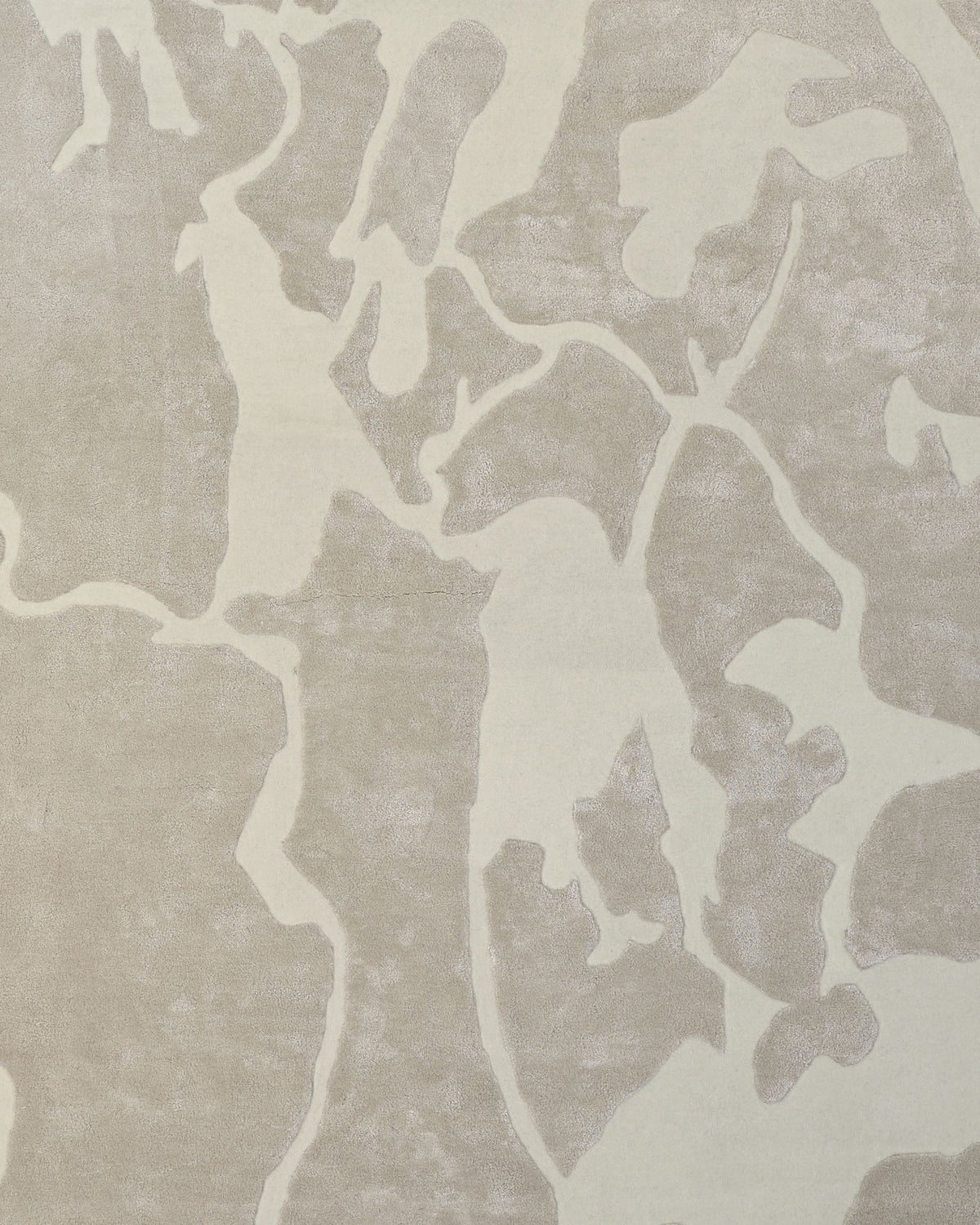 Introducing the Multi Color Handmade Area Rug - HTWV-132 by RAMSHA HOME: This rug features an abstract beige and cream pattern with organic, irregular shapes and soft, flowing edges, evoking a fluid marbled or camouflage-inspired design. Crafted as a handtufted piece in luxurious wool viscose, its slightly raised, velvety texture adds depth and softness to any space.