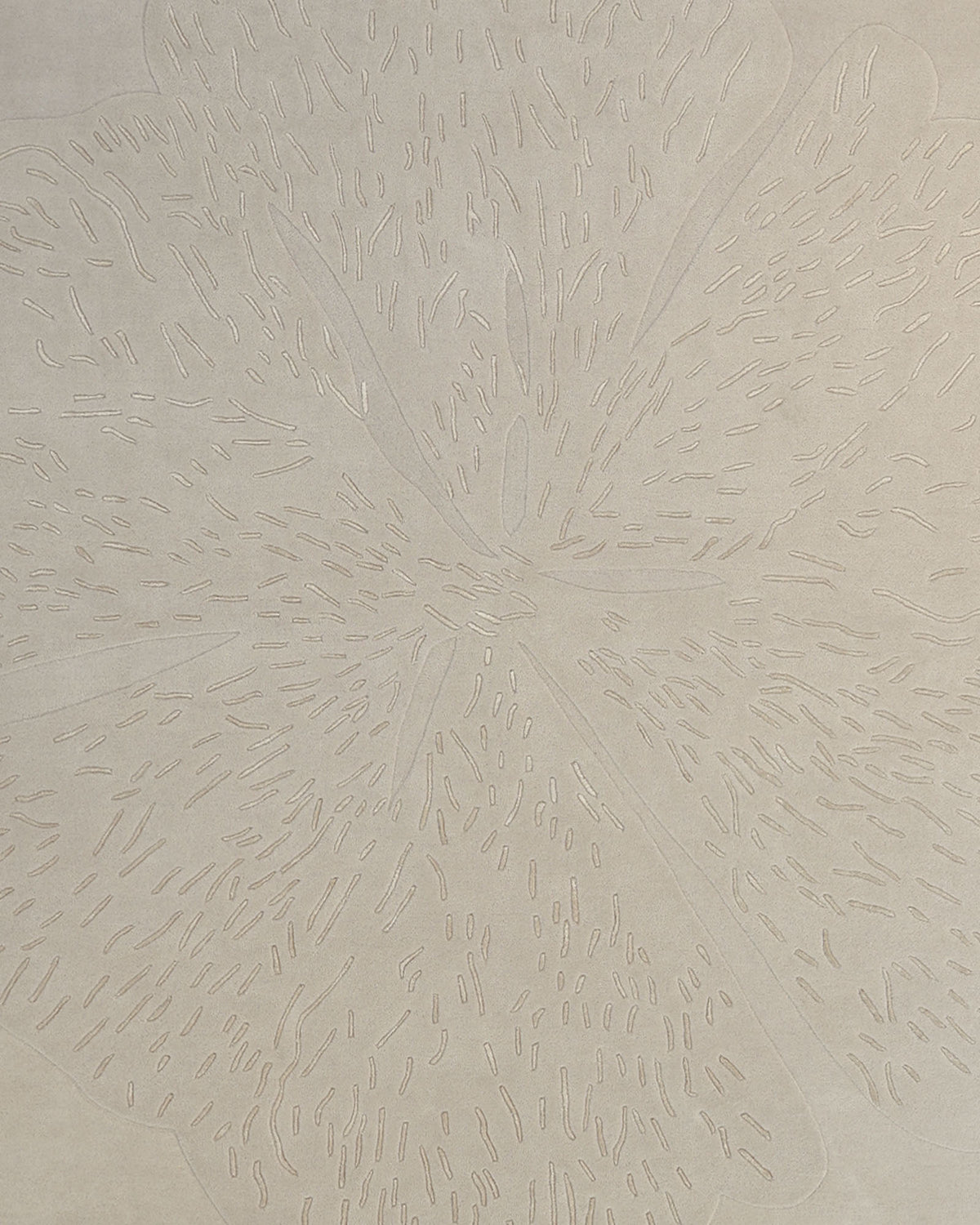 Featuring a light grey, textured surface with an intricately embossed floral pattern reminiscent of organic petals and leaves, the Embossed Floral Solid Light Grey Rug – HTWV 171 by RAMSHA HOME beautifully encapsulates sophisticated hand tufted artistry.
