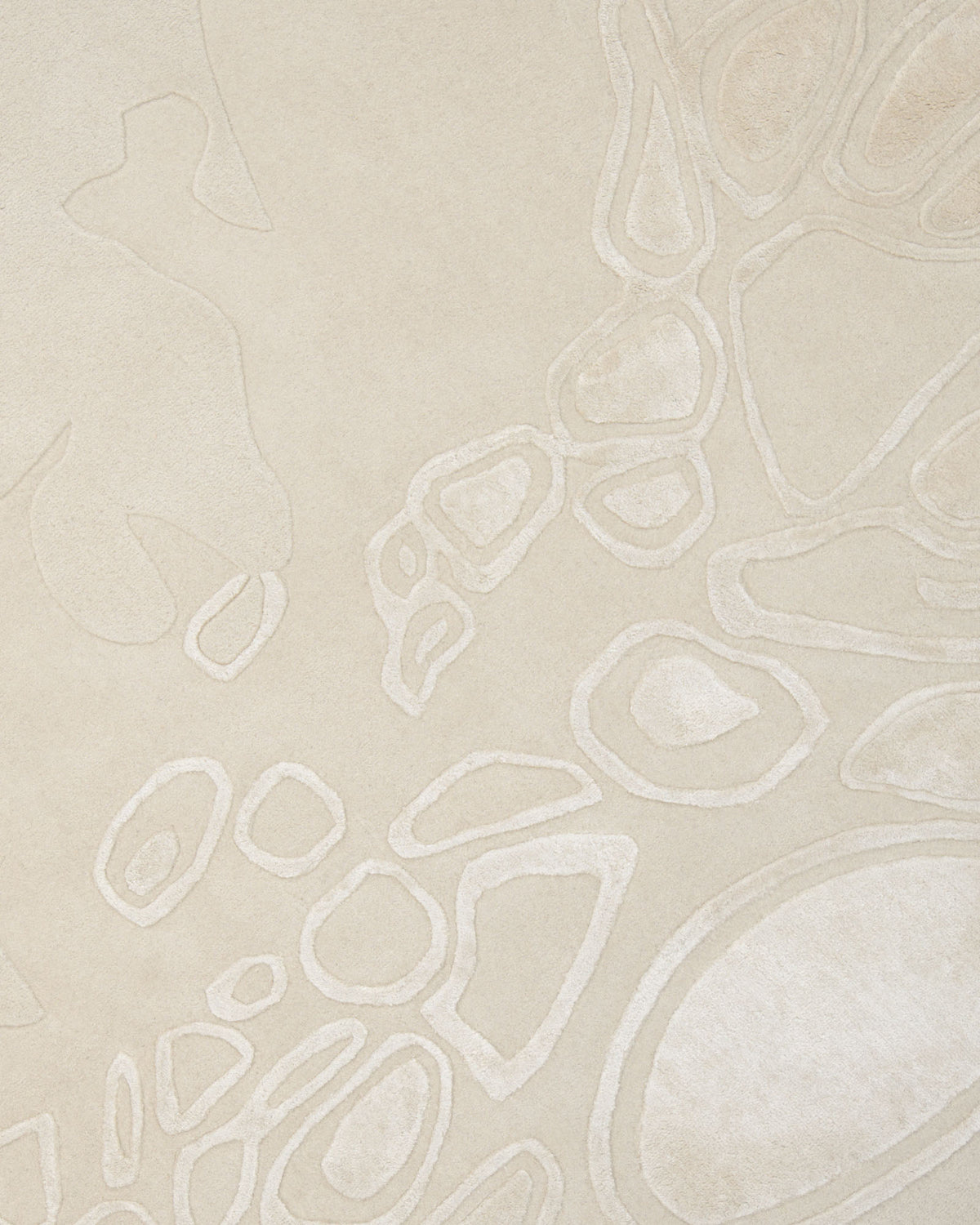 The Modern Sculptural Shape Rug Neutral Beige 200 cm – HTWV 207 by RAMSHA HOME features a beige surface adorned with abstract, irregularly outlined shapes and soft, raised textures that mimic organic forms, creating a sophisticated and contemporary rug design.