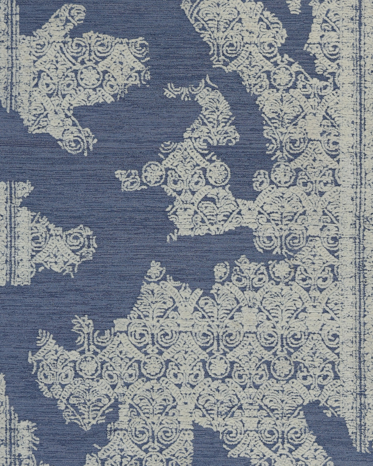 The RAMSHA HOME Blue Mosaic Handcrafted Luxury Area Rug (HTW 145) showcases an elegant blend of blue and cream hues, with intricate mosaic and floral patterns set against a textured blue backdrop reminiscent of a vintage map.