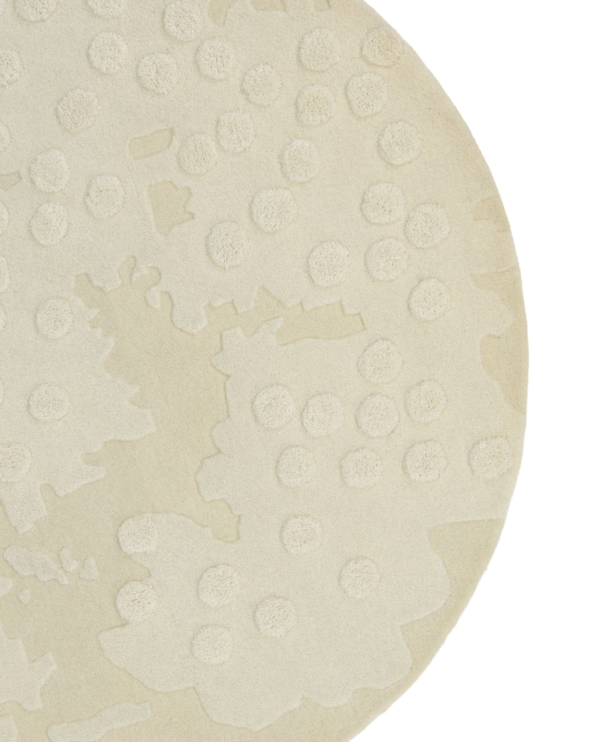 A close-up of the RAMSHA HOME Round Home Decor Handmade Carpet – HTW-67, a beige hand-tufted wool rug featuring raised circular patterns and abstract textured shapes, photographed on a white background.