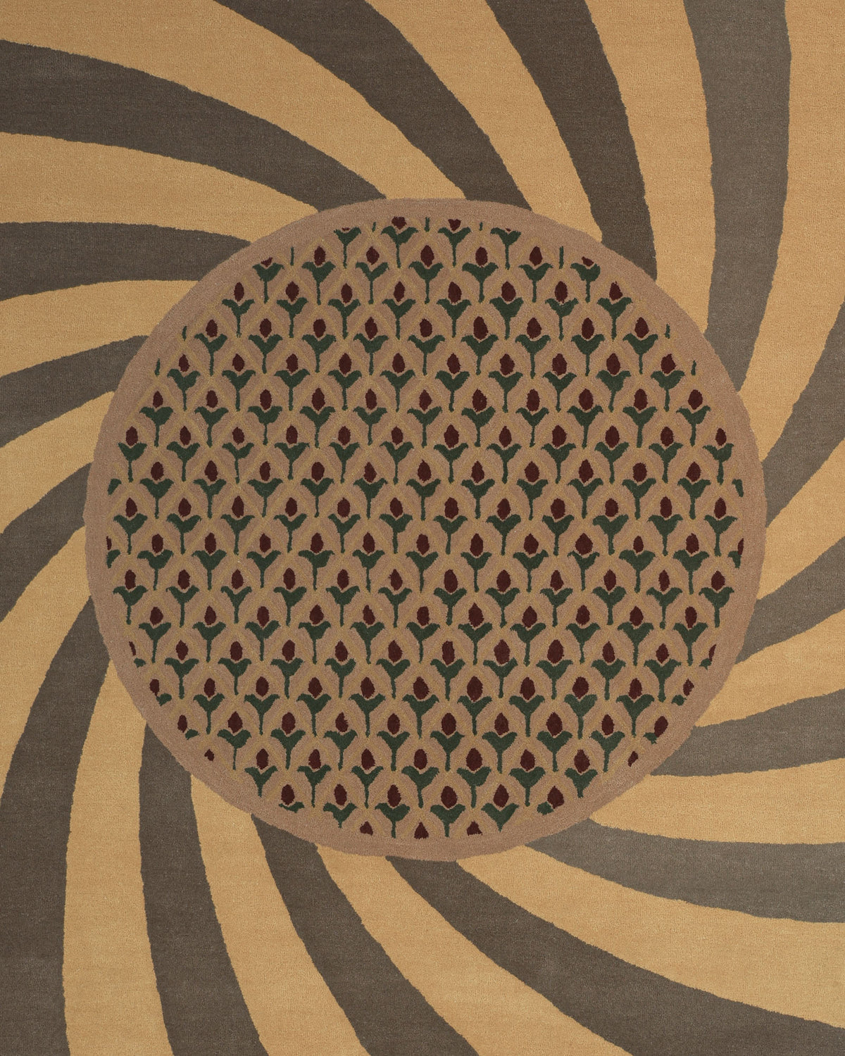 The Modern Mustard & Grey Wool Carpet HTW-30 by RAMSHA HOME features an oval adorned with a geometric pattern of small tree-like shapes, set against a brown and tan spiral background for an optical illusion effect. Expertly hand tufted from luxurious New Zealand wool, this modern area rug combines striking design with premium comfort.