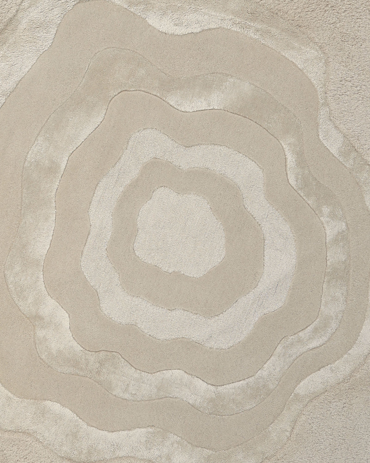Featuring an abstract design of concentric, irregular rings in multi-colored shades reminiscent of topographic map lines or tree rings on a soft, textured surface, the RAMSHA HOME Multi Color Handmade Area Rug - HTWV 148 is hand-tufted from a premium wool blend. This neutral area rug infuses any space with organic elegance and subtle sophistication.